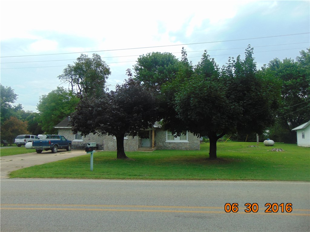 Investment opportunity - Great rental potential. With a little TLC, this one is priced to sell and would bring in a nice income.  Large half acre yard with a small outbuilding. It features 3 bedrooms, 2 baths an attached carport plus 1800 plus square feet.  Right on the Highway.