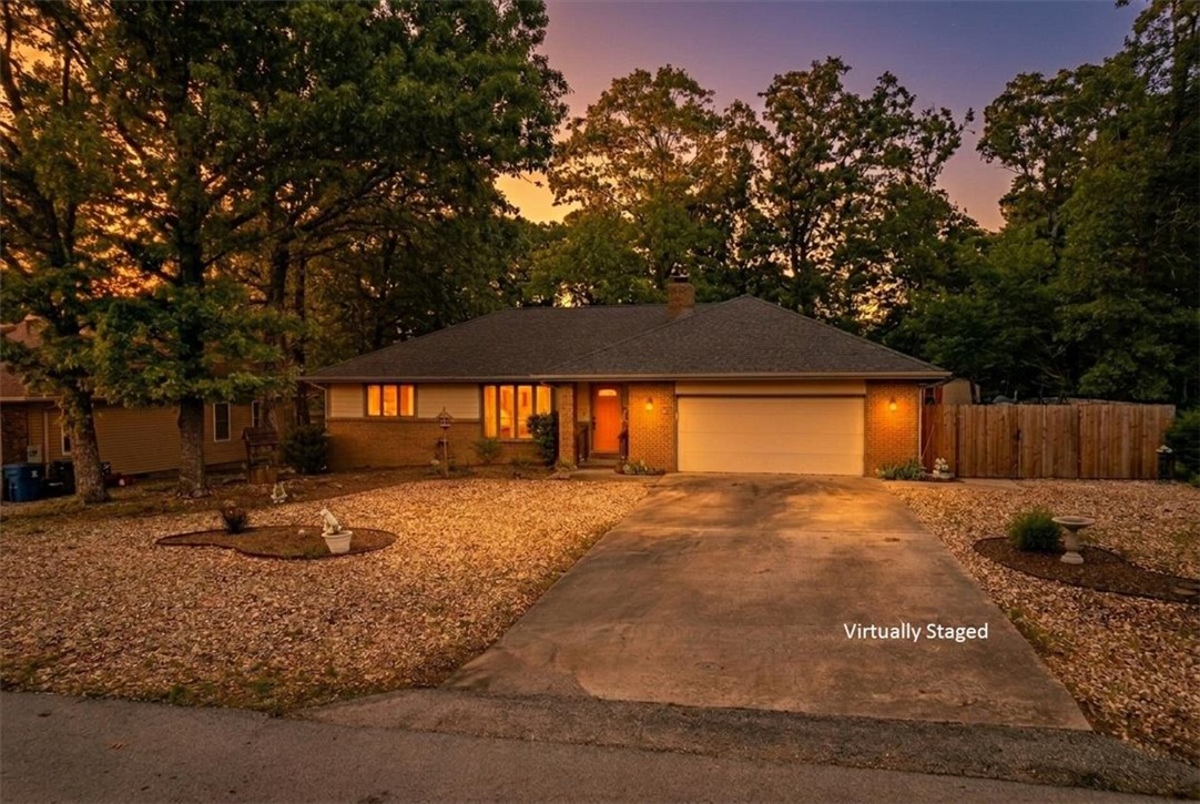 Welcome home to this inviting 2BR/2BA retreat offering 1,440 sq ft of comfortable living. Built in 1988 and well cared for, with major updates already complete: roof and water heater (July 2019) and HVAC (July 2021). The spacious kitchen features abundant cabinet storage and newer stove, dishwasher, and microwave. Gather around the cozy, newly cleaned propane fireplace in the living room. Set on a 0.3 acre lot, there’s room to breathe, play, or garden. Enjoy a fenced backyard, 10x16 storage building for tools or hobbies, and easy, low-maintenance gravel landscaping. Just moments from Loch Lomond lake access and near Branchwood Nature Trail, Branchwood Recreation Center, and Branchwood Golf Course, and another minutes away. Minutes to I-49 and located within the Gravette school district. Whether you're relaxing at home or exploring nearby trails and the lake, this is the kind of place that just feels right—come take a look and imagine yourself at home here.