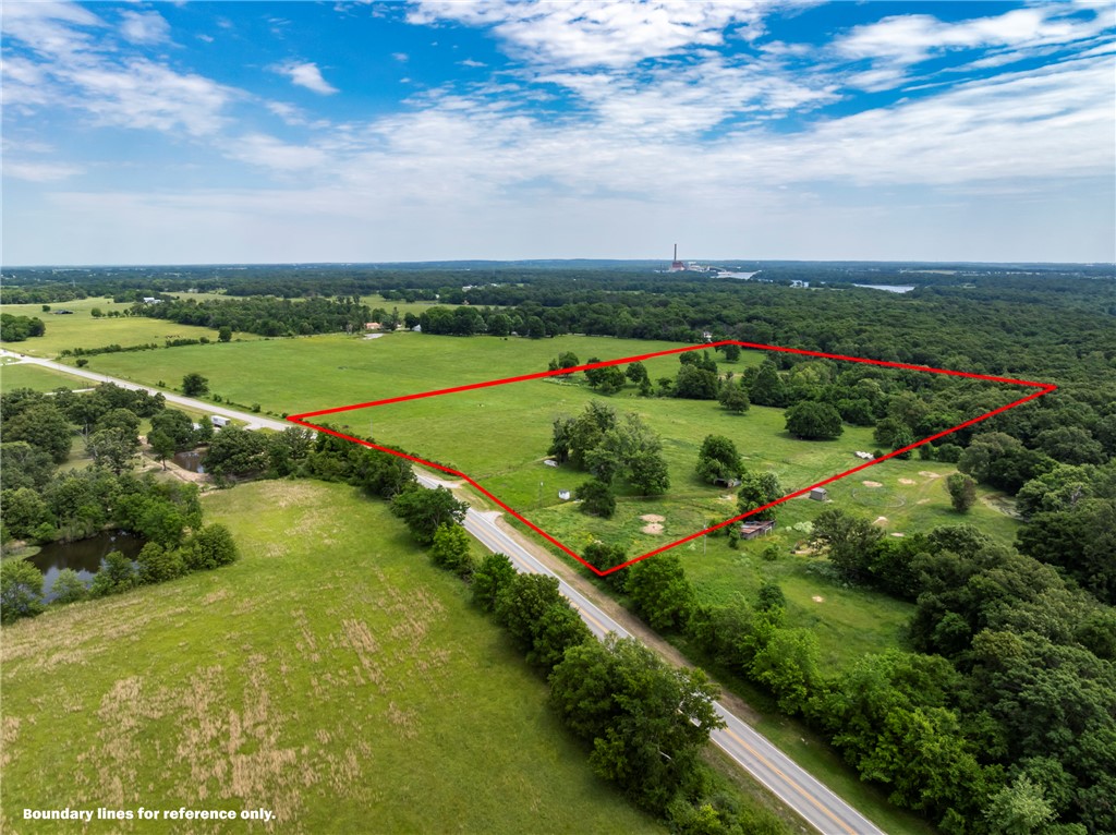 Discover 25 beautiful acres just north of Siloam Springs—only 4 miles from the charm of historic downtown. This versatile property offers endless possibilities: build your dream estate, create a hobby farm, or develop a residential neighborhood. Rural water is available, and the land previously supported a home, offering existing electric, well, and septic on site. The ideal blend of convenience, privacy, and potential! Photos with sketched in boundary lines are just approximations. Exact acreage and legal description is subject to a new survey, splitting approximately the south 25 acres from a 52 acre parcel. Also listing the entire 52 acre parcel, See MLS#1347742. Also listed as a 37 Acre parcel MLS#1328527. Listed as a 10 Acre parcel MLS#1347753.
