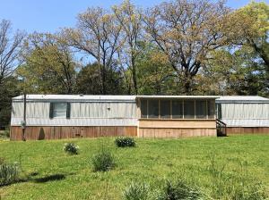 Secluded get away on 2.5 acres. 3 bed, 2 full bath home with a screened in front porch on the outskirts of Ola.