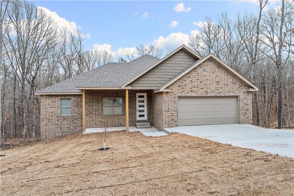 Conveniently located in the heart of Bella Vista, this new construction 3-bedroom, 2-bath home offers a desirable open floor plan designed for modern living and effortless entertaining. Featuring durable luxury vinyl plank (LVP) flooring throughout with no carpet, the home provides both style and low-maintenance comfort. The spacious living area flows seamlessly into the kitchen and dining spaces, creating a bright and welcoming atmosphere. Enjoy easy access to everything Bella Vista has to offer, including scenic golf courses, miles of hiking and biking trails, parks, and community amenities, making this home perfect for those who value both convenience and an active lifestyle.