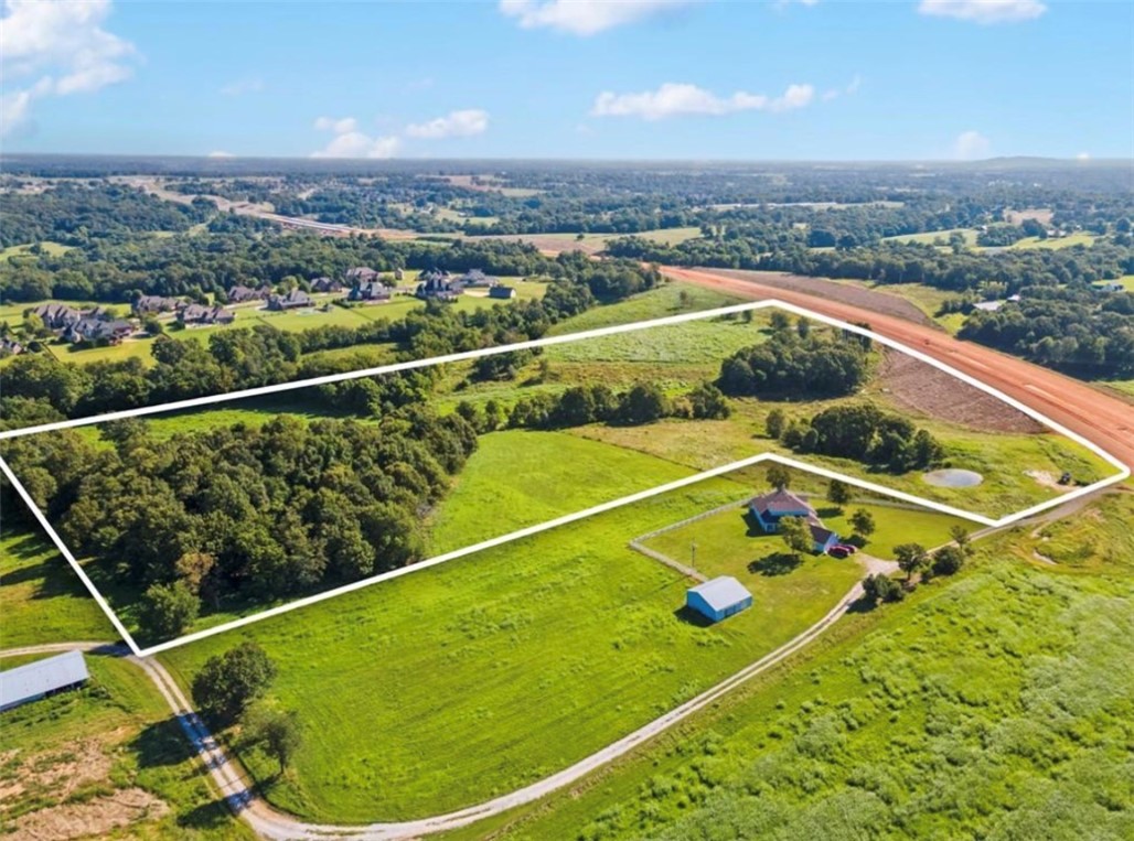 Fantastic 11.5 acre parcel located in Northwest Arkansas, perfect investment opportunity! Ideal for residential or commercial development, the land is currently zoned R3, and there's potential for commercial. Utilities available and no restrictions, options for development are limitless.