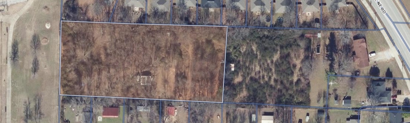 Prime nearly 2-acre property in a highly desirable Rogers location just minutes from Downtown Rogers, local restaurants, parks, shopping, and community events. The property backs up to Veterans Park, offering a unique setting with privacy, open space, and convenient access to everything Northwest Arkansas has to offer. This property presents a rare opportunity for someone looking for space inside city limits with long-term potential for development, recreation, or investment. A recorded 15-foot utility/right-of-way easement is in place. Buyer to perform all due diligence regarding access, utilities, zoning, and future development possibilities.. With very few larger tracts remaining this close to downtown Rogers, this is an opportunity worth exploring for the right buyer with vision.
