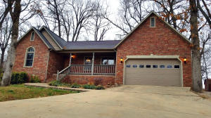 Contemporary 3 Bedroom, 2 Bath all brick home located on a partially wooded lot in the Broodfield Subdivision with lots of hardwood floors, open floor plan with vaulted ceiling in kitchen/living/dining ares as well as sun room for additional usable space. Just add a window heat/air unit and you have an additional 147 Sq. Ft. of heated/cooled living space. SOLID oak cabinetry, wood trim and doors through out. Master bedroom is split off from other bedrooms for more privacy. Wood privacy fence around back yard and so much more...
