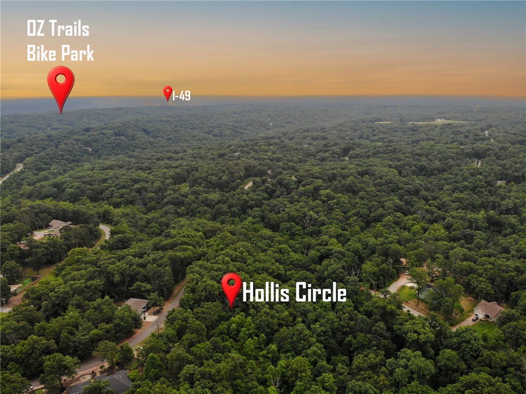 Rare opportunity to own a hard-to-find double lot totaling 1.45 acres in a peaceful cul-de-sac, perfectly situated near Lake Windsor and just minutes from Bella Vista’s popular bike trails. This spacious property backs up to POA green space, offering added privacy and a natural buffer, no rear neighbors! Located in one of the most desirable areas of Bella Vista, this lot is ideal for building your dream home, or vacation retreat. With mature trees and easy access to nearby recreational amenities, it strikes the perfect balance between seclusion and convenience. Enjoy all the benefits of Bella Vista living, including seven private lakes, multiple golf courses, scenic parks, and a welcoming, active community.