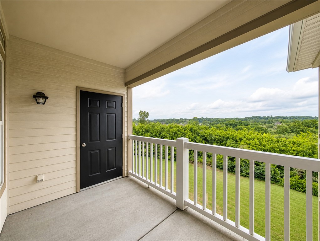 Check out unit 302! This one bedroom condo is in an amazing location in the middle of Fayetteville! This 1BD/1BA condo includes a galley kitchen, stainless steel sink, pantry and eat in kitchen area. The open living/dining space features hardwood laminate floors and tall ceilings. The bedroom includes carpet, lots of natural light, and a walk-in closet with the full bath located just off the hallway. This Condo includes a sought after upper level open-view balcony with extra storage closet, covered and with a beautiful view of the green space and trees! This location borders NW Arkansas Mall and offers easy access to l-49 and 71B, trails, shopping, and the University of Arkansas. The condo's community amenities include a fitness center, resort-style pool, coffee cafe, clubhouse,  dog park and more!