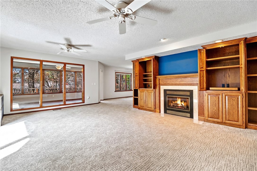 Quality-built custom home by Gene Knight where you can feel the craftsmanship the moment you enter. Spacious living room features built-ins and a cozy propane fireplace. The kitchen offers Corian countertops, cabinets with pull-out drawers, a new glass-front dishwasher, quality appliances, and the refrigerator conveys. Dining area has built-in china cabinet. Relax in the sunroom w/floor-to-ceiling windows overlooking the yard. The primary suite features an impressive 13x13 walk-in closet and a bath w/ custom whirlpool tub and ADA walk-in/roll-in shower. Guest bedroom includes LVP flooring. The 3-car garage offers a 120V-20amp dedicated circuit, side door, and utility sink. Enjoy outdoor living from the deck leading to a pergola-covered entertaining area. Updates: new roof, fence, and sod in 2024. A 50-gallon water heater and 14-SEER HVAC in 2025. Radiant heat shield in attic. If you’re searching for Bella Vista real estate, NWA homes & a unique non-cookie-cutter properties, this one-level custom home is a must see.