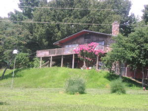Great Location just south of Jasper. A very nice parcel of land with beautiful views. Large home with sun room, 3 bedrooms, large fireplace, basement with bath, outside shower area, decks, screened in hot-tub area, master bath, landscaped with an park-like feel. End of the drive for that privacy feel. Easy access. Nice garden area. Small pond on property. This is well-maintained, very nice home
