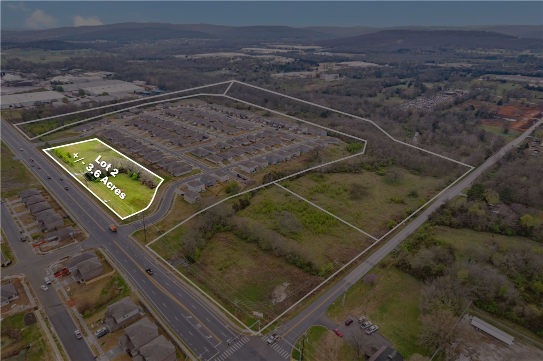 +/- 3.57 acres of LEVEL land with 790 feet of frontage on E 15th St in Fayetteville, Arkansas, which sees +/- 16,000 VPD. Sewer, water, and electric are readily available on site or in close proximity. Positioned in front of a recently constructed subdivision developed by a leading national builder. Partly zoned C-1 Neighborhood Commercial, which would make it a great spot for restaurant/cafe, retail and/or office spaces, QSR, gas station, or Short-Term Rentals. Conveniently located just a short 5-minute drive to Downtown Fayetteville and the University of Arkansas Campus. This parcel is strategically located between two entrances into a new residential development enabling high exposure for a new retail development or many other commercial real estate development opportunities. This lot is zoned Partial NC and Partial C-1: C-1 - Neighborhood Commercial. This zone is made to provide convenience goods and personal services to people living in the surrounding residential area.
