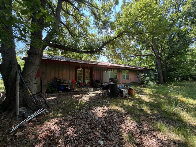Fixer Upper on 1.08 Acres at the end of a long private wooded drive.  The home has 3 bedrooms, 1 bath, with an extra-large storage space connected to the home.  1394 sq ft of potential.  Lots of privacy and room to create.  Home is going to need some work.