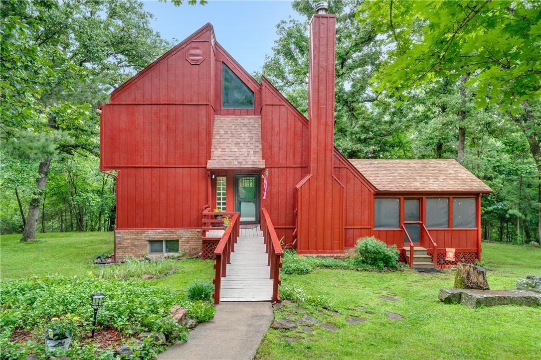 Situated on 50 peaceful acres in the foothills of the Ozarks, this unique three-story contemporary home
was designed by two University of Arkansas architecture students, inspired by E. Fay Jones, an apprentice of Frank Lloyd Wright. With an open floor plan, this charming home boasts a custom kitchen with quartz countertops, a skylight, copper backsplash, center island with a wet bar, stainless steel appliances, and handmade beveled glass cabinets. The main house features 3 bedrooms, 2 baths, a high efficiency woodburning fireplace, and a custom-built sunroom. The property includes a spacious garage with workspace and a 30x50 barn with penned areas for animals. Nature lovers will enjoy 10 acres of pasture, 40 wooded acres, a 3-season stream, and hiking/ATV trails. Hunting opportunities abound, especially for deer. This property offers a setting for anyone who values privacy, nature, and a variety of outdoor activities with serene country living and easy access to the vibrant culture of Northwest Arkansas.