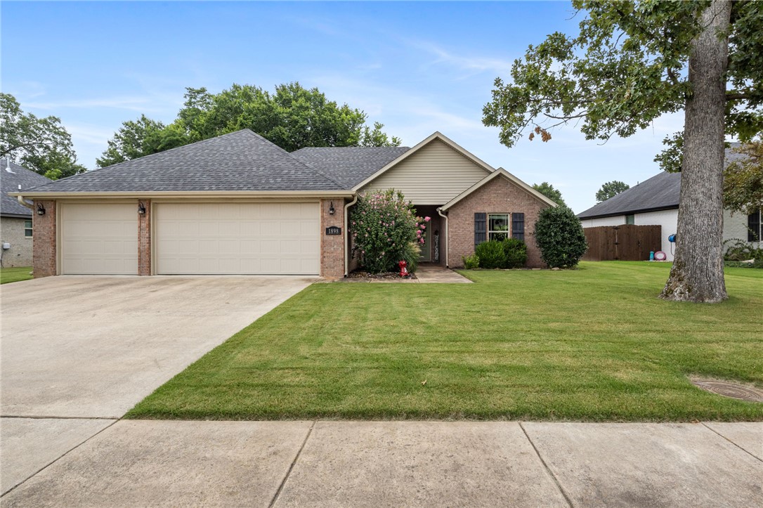 Welcome to this well-appointed 3-bedroom, 2-bathroom home offering 1,714 sq ft in a sought-after East Fayetteville location. The large open-concept kitchen is the heart of the home, flowing seamlessly into the living and dining areas — perfect for entertaining or everyday family life. A convenient mudroom off the garage entry adds practical storage and keeps everyday clutter organized. Step outside to the oversized covered patio, ideal for relaxing or hosting year-round. The layout is complemented by a rare 3-car garage, ideal for extra storage, a workshop, or multiple vehicles. Set on a generous .23-acre lot, there's plenty of room to enjoy outdoor living. Just minutes from the University of Arkansas, shopping, dining, and local schools.