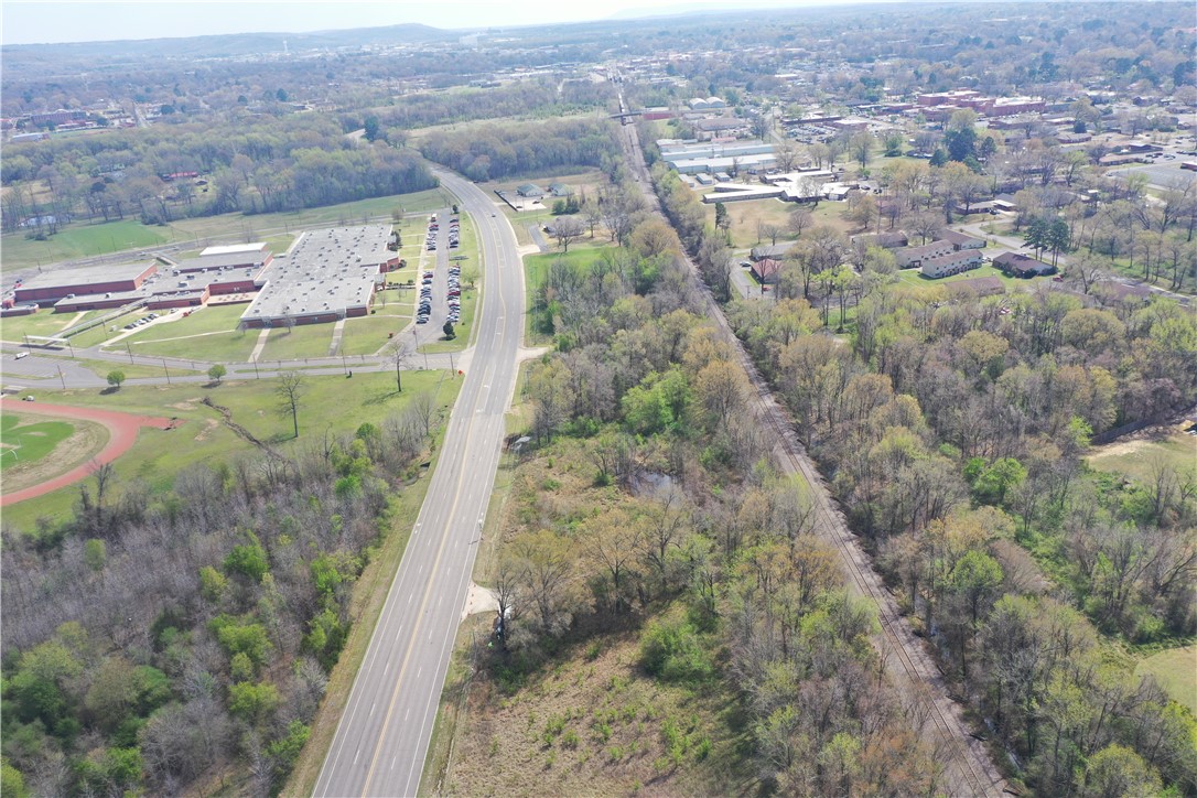 Just under 4 acres of prime commercial lots strategically located offering high visibility and excellent accessibility. Situated on a high-traffic road, this property benefits from substantial daily exposure, making it an ideal spot for businesses seeking to attract attention. Across from Russellville Junior High, this lot enjoys proximity to both educational and recreational hubs, including the Bona Dea Trails. With the vibrant downtown entertainment district just minutes away, this location provides a perfect blend of commercial potential and community connectivity. Perfect for retail, hospitality, or other commercial ventures, this lot presents a unique opportunity to capitalize on a high-demand, high-traffic area with substantial future growth potential.