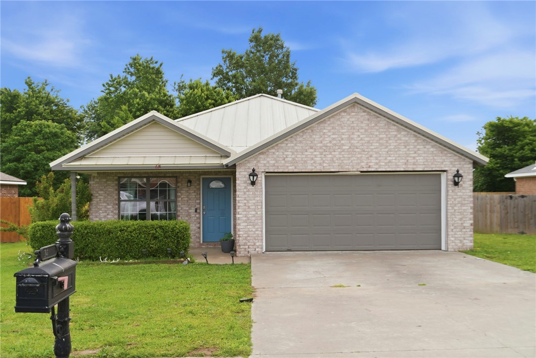 This 3-bedroom, 2-bath home offers functional upgrades, flexible space, and a prime location less than 2 miles from Main St and Hwy 102. Inside, you’ll find a clean, open layout with no carpet throughout and a large kitchen island that serves as the heart of the home, perfect for everyday living and entertaining. Enjoy the flat backyard with a brand-new fence, ideal for relaxing, hosting, or letting kids and pets play, while the durable metal roof adds long-term value and peace of mind. The garage has been partially converted into a dedicated office space with air ducts and a closet, while the remaining area functions as a shop, and this setup can easily be removed to restore a full garage if desired. Located in the Bentonville School District, zoned for Bentonville West High School, walking distance to the neighborhood park, and just 12 minutes from Coler Mountain Bike Preserve.