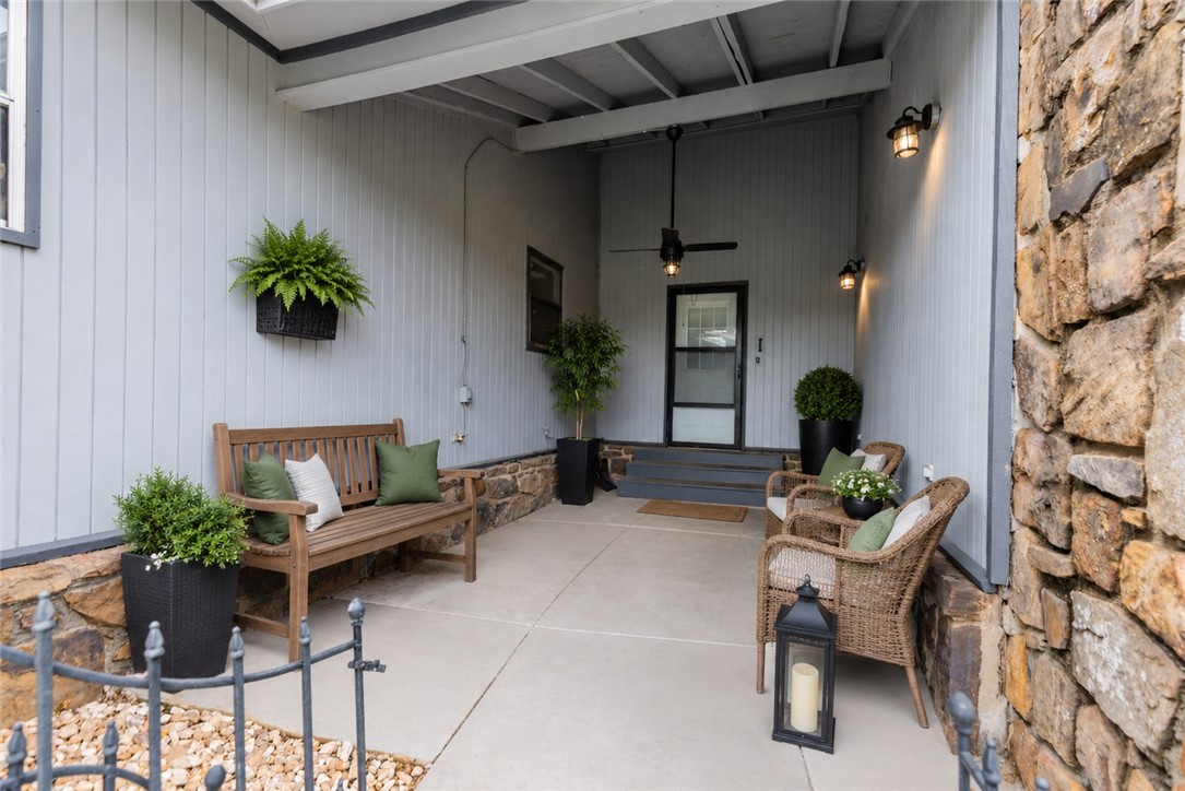 Imagine ending your day in this townhome where life feels a little easier. Sip your morning coffee in the enclosed sunroom, spend summer evenings grilling under the covered patio, or unwind beneath the gazebo overlooking the spacious, fully fenced backyard and with room to garden, entertain, play, or let your furry friend roam through the convenient pet door, this outdoor space is designed to be enjoyed. Inside this 2 bed, 2 bath, single-level floor plan offers comfortable everyday living with generous gathering spaces, a cozy stone fireplace for cooler seasons. (The enclosed sunroom is not included in the heated square footage.) Conveniently located in an Rogers, you'll be just minutes from shopping, restaurants, Mercy Hospital, business centers, parks, and I-49, making commuting and daily errands a breeze. Whether you're searching for your next home, looking to downsize, or wanting an investment property you can enjoy the flexibility of this property and fit your lifestyle as it's ready to welcome its next owner.