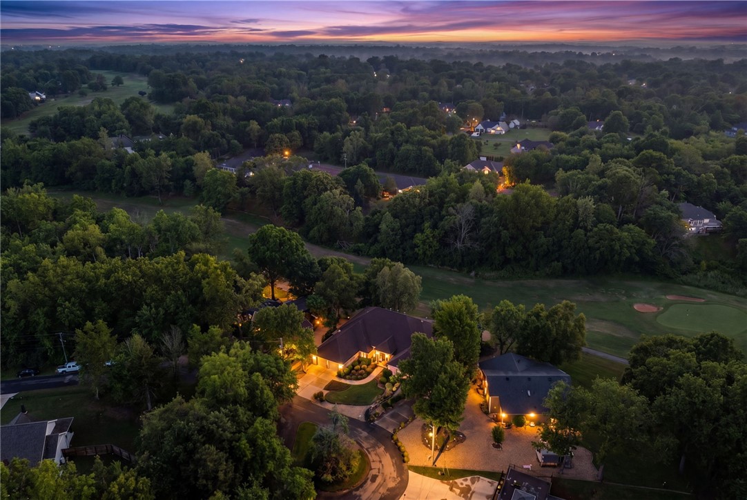There is a certain luxury in waking up to sweeping fairway views. A luxury in slowing down. In quiet mornings with coffee on the patio. In watching the light change across the course as the day begins and ends.
At 16 Ellwood Circle, golf isn’t simply nearby, it’s part of the view, part of the atmosphere, & part of the lifestyle. This beautifully updated single-level residence was designed to embrace its surroundings, with walls of windows that invite the outdoors in & create a seamless connection to the landscape beyond. Located on Highlands Golf Course, one of Bella Vista’s premier golf settings, this home offers the rare combination of refined comfort, effortless living, & a view that never grows old. Whether entertaining friends or enjoying a quiet evening at home, the setting offers a rare sense of peace just moments from Bella Vista's most coveted amenities. Some homes are measured in square footage. Others are measured in how they make you feel... & this one will feel like you're finally home.  2 Bdrm septic