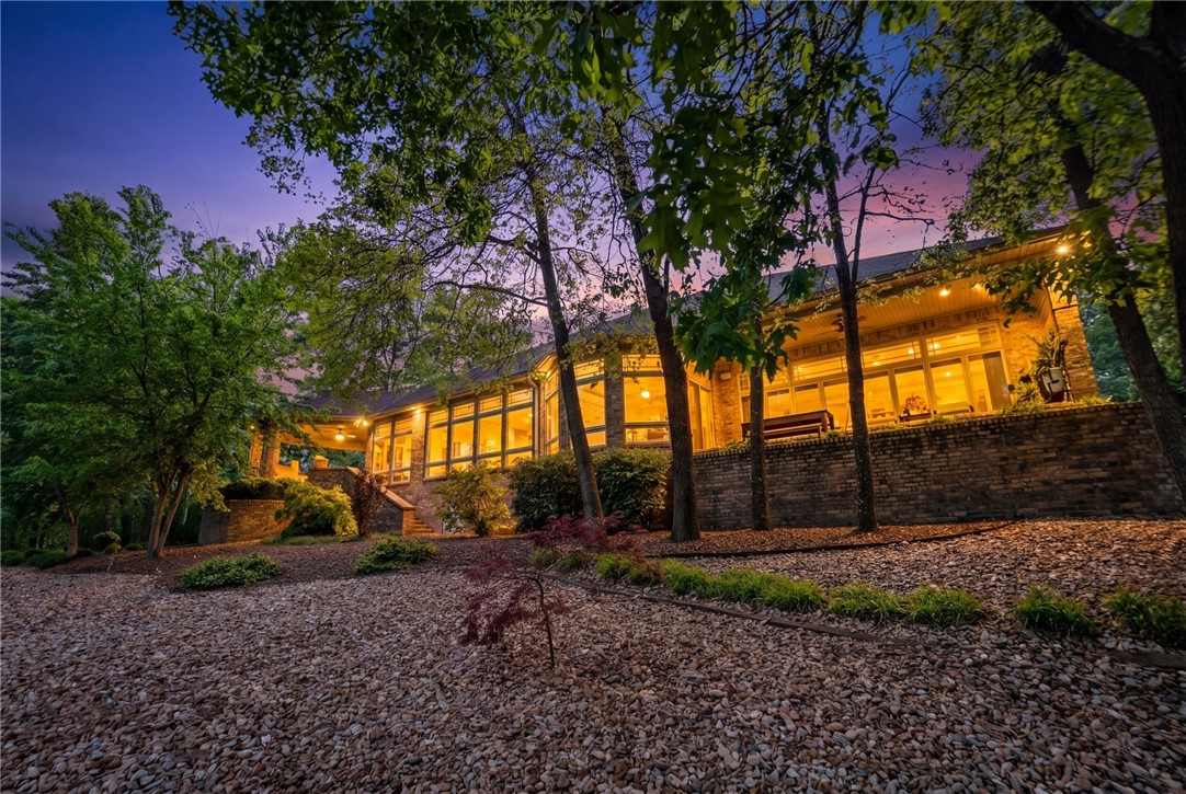 There is a certain luxury in waking up to sweeping fairway views. A luxury in slowing down. In quiet mornings with coffee on the patio. In watching the light change across the course as the day begins and ends.
At 16 Ellwood Circle, golf isn’t simply nearby, it’s part of the view, part of the atmosphere, & part of the lifestyle. This beautifully updated single-level residence was designed to embrace its surroundings, with walls of windows that invite the outdoors in & create a seamless connection to the landscape beyond. Located on Highlands Golf Course, one of Bella Vista’s premier golf settings, this home offers the rare combination of refined comfort, effortless living, & a view that never grows old. Whether entertaining friends or enjoying a quiet evening at home, the setting offers a rare sense of peace just moments from Bella Vista's most coveted amenities. Some homes are measured in square footage. Others are measured in how they make you feel... & this one will feel like you're finally home.  2 Bdrm septic