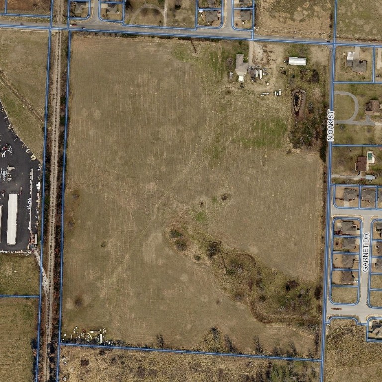 Rare opportunity to own 45 acres, zoned industrial w/some C2, 1300' of frontage on E. Apple Blossom, centrally located & situated between 71B & 265 in Lowell/Bethel Heights.  Most utilities available at road/on site including electric, water, & sewer.  The opportunity for a railhead exists as the west boundary sits adjacent to an Arkansas & Missouri Railroad track. Extreme development potential given its location on/near two roads (Apple Blossom & 265) marked for expansion in regional planning documents.