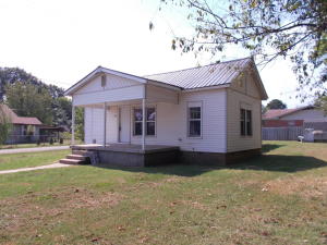 Charming home on a corner lot in City of Clarksville,  This 3 bedroom 1 bath home has been  updated and remodeled! Spacious living room, large kitchen with new refrigerator, utility room and a covered front porch. Wood look flooring throughout this home. Windows have been updated too. Central heat and air, Cable TV and internet. This is a great starter home! Close to Clarksville schools and walking distance to Clarksville water-park and MV Center. Investors this home is Currently Tenant Occupied.