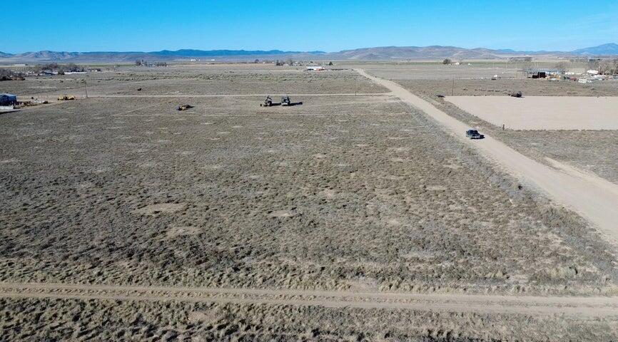 0.50 acre, flat and ready to build, lot in Beryl Junction with a well to be installed prior to closing and a well share agreement with the parcel to the South. Includes 0.5 Acre Foot of Water Right #71-6066 (Priority Date 12/27/1956). Dixie Power is located just 200 feet away on 300 East. Excellent Highway 18 access with easy year-round access. Ideal for a primary residence, second home, cabin, or weekend retreat. Bring your RVs, trailers, and toys. Great opportunity to build now or buy and hold as water-backed land continues to grow in value. Located 15 minutes to Enterprise for groceries, gas, schools, dining, and medical, and about 50 minutes to St. George or Cedar City. Close to reservoirs for boating and fishing. Explore all of the nearby mountain trails with your off road vehicles.