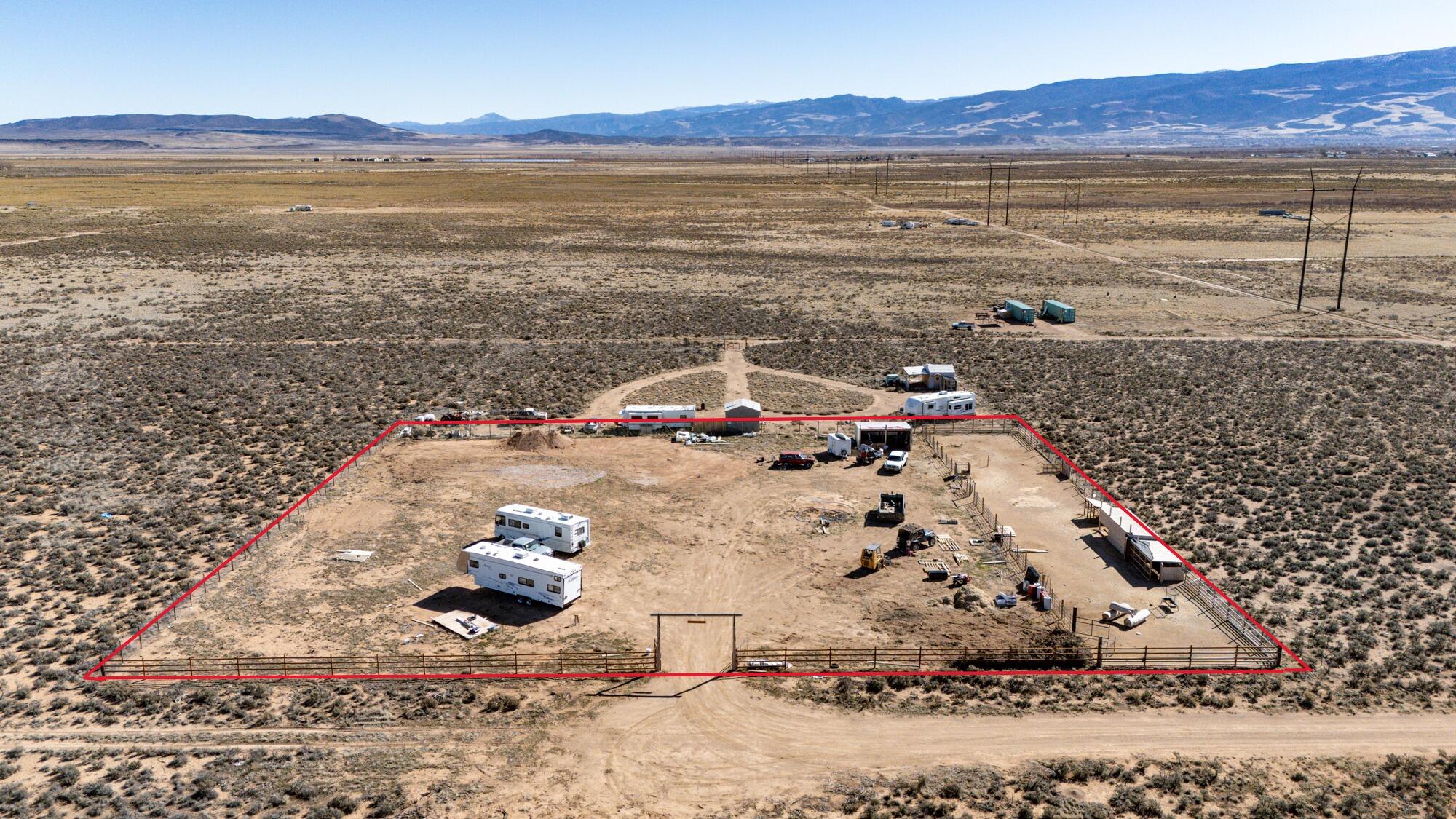 Build-ready 1.25-acre property in Cedar Valley Acres with well, septic, fencing, and water rights already completed. The property is fully fenced and features a well drilled in 2024, 1 acre-foot of water rights with a 1963 priority date, and a recently installed septic system--giving buyers a strong head start toward building. The well is currently operated by generator, and power lines are located nearby for convenient future connection. A storage shed valued at approximately $7,000 is also included. With many of the major improvements already completed, this lot offers a strong head start for building your dream home if you're wanting extra space or need room for animals, all while enjoying a rural lifestyle and still being within a reasonable distance to town. Please close gate! Additional property details: The well depth is 204' with water encountered at approximately 58'. The well was drilled in 2024 by Thayer Well Drilling and tested at approximately 30 GPM with 5' drawdown during a 5-hour pump test. The well is located at N 387' E 670' from the W4 corner of Section 32, Township 34S, Range 11W, SL B&M. The septic system is a 1,000-gallon tank, and according to the geological designer, is approved for a 3-bedroom, 2-bath home. The system includes two clean-out tubes and an exposed septic tank lid access.