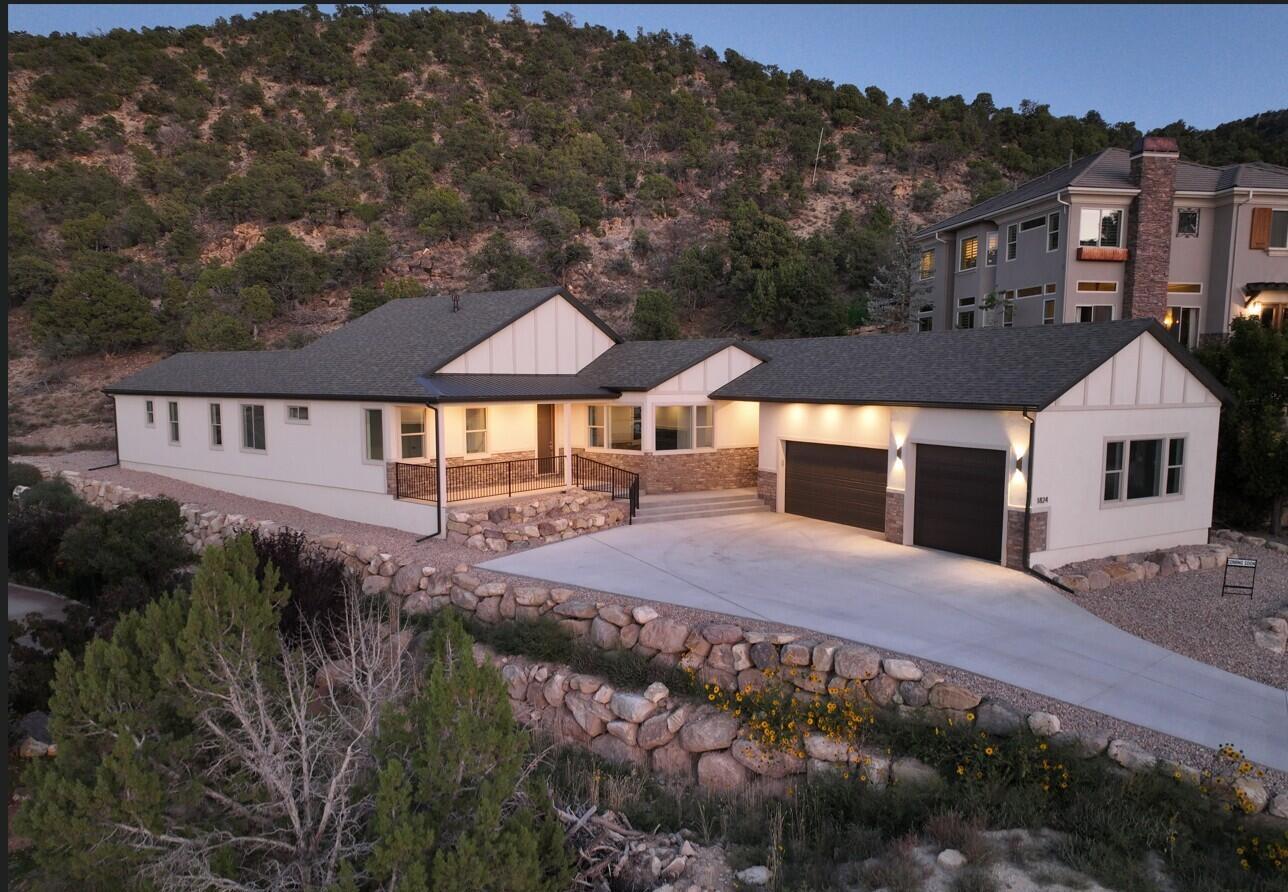 Priced to sell this canyon backed home in Ashdown Forest offers privacy modern design and future potential. Backing directly to the mountain with no backyard neighbors this home delivers a quiet setting while staying close to Cedar City conveniences. Inside enjoy open concept living tall ceilings and a designer kitchen with an oversized island and butler's pantry. The wall behind the pantry is already plumbed for a future second story offering rare expansion potential. Fiber optic internet is already connected making this ideal for remote work or second home living. The primary suite features patio access and a spa inspired bath. The seller is motivated and ready to review strong offers. Schedule your private showing today.