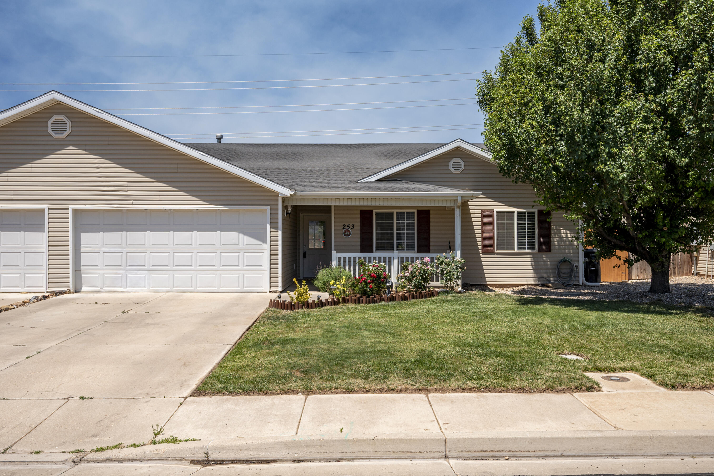 Whether you're searching for an affordable place to call home or a great investment opportunity, this 3-bed, 2-bath twin home is worth a look! Located on the west side of Cedar City, it offers comfortable single-level living with no steps into the home and a highly functional floorplan. A charming covered front porch welcomes you inside, where a cozy gas fireplace anchors the living room. All major appliances, including the washer and dryer, are included. Enjoy the convenience of an attached 2-car garage with room for parking and storage. Outside, enjoy thoughtfully landscaped front and back yards with lush green space and colorful flowers. The fully fenced backyard offers privacy and space to relax, garden, or play. Plus, with no HOA, you'll enjoy added flexibility and fewer restrictions. The front exterior immediately creates a welcoming first impression with a lush lawn, colorful flower beds, and a mature shade tree that adds character and curb appeal. A covered front porch provides the perfect spot for rocking chairs, a porch swing, or a small seating area where you can enjoy your morning coffee, greet neighbors, or relax in the evenings.

Inside, you'll find an inviting open-concept floorplan designed to make everyday living easy. Vaulted ceilings enhance the sense of space throughout the main living area, while the seamless flow between the living room, kitchen, and dining area makes the home feel connected. The cozy gas fireplace serves as a focal point in the living room, creating a warm and comfortable gathering space during cooler months.

The kitchen offers a practical layout with ample cabinet storage and countertop workspace, as well as durable tile flooring for easy maintenance. A pantry provides additional storage for food and kitchen essentials, helping keep everything organized and within reach. The extended counter seating allows room for two bar stools, making it a natural place for casual meals, homework, or conversation while cooking. All kitchen appliances are included, making moving in even easier. Just off the kitchen, the dedicated dining area provides space for everything from everyday meals to special occasions.

The primary bedrooms is designed as a comfortable retreat, featuring a walk-in closet and a private ensuite bathroom. Two additional bedrooms offer flexibility for family members, guests, hobbies, or a home office. The secondary bedrooms are conveniently located near the guest bathroom and laundry area, creating a functional layout that works well for a variety of lifestyles.

One of the most appealing features of this home is its true single-level design. With 1,420 square feet of living space and no steps required to enter the home, it offers accessibility, convenience, and long-term livability. 

The attached two-car garage provides secure parking and valuable storage space for tools, seasonal items, recreational equipment, or outdoor gear. Additional parking is available on the driveway, and street parking offers flexibility when entertaining guests.

Outside, the fully fenced backyard creates a private outdoor retreat. The beautifully landscaped yard features a lush green lawn bordered by established flower beds filled with colorful blooms throughout the season. Several trees have been planted throughout the space as well. Whether you envision space for children, entertaining, gardening, letting pets roam, or simply enjoying time outdoors, the backyard offers plenty of possibilities. A small storage shed is also included, providing convenient space for gardening tools and outdoor equipment.

Another significant advantage is the absence of an HOA. Without monthly HOA dues or additional association restrictions, you'll enjoy greater flexibility and control over your property while still benefiting from a well-maintained neighborhood setting.

Conveniently located near shopping, dining, schools, parks, and other Cedar City amenities, this home combines comfortable living and practical features in a location that makes daily life easy.

2 minutes to Iron Springs Elementary School
5 minutes to Cedar City Regional Airport
7 minutes to Southern Utah University
9 minutes to downtown Cedar City
9 minutes to restaurants and shopping at Providence Center in Cedar City
10 minutes to Cedar Middle School
12 minutes to Cedar High School
12 minutes to Cedar City Intermountain Hospital
50 minutes to St. George
2.5 hours to Las Vegas
3.5 hours to Salt Lake City