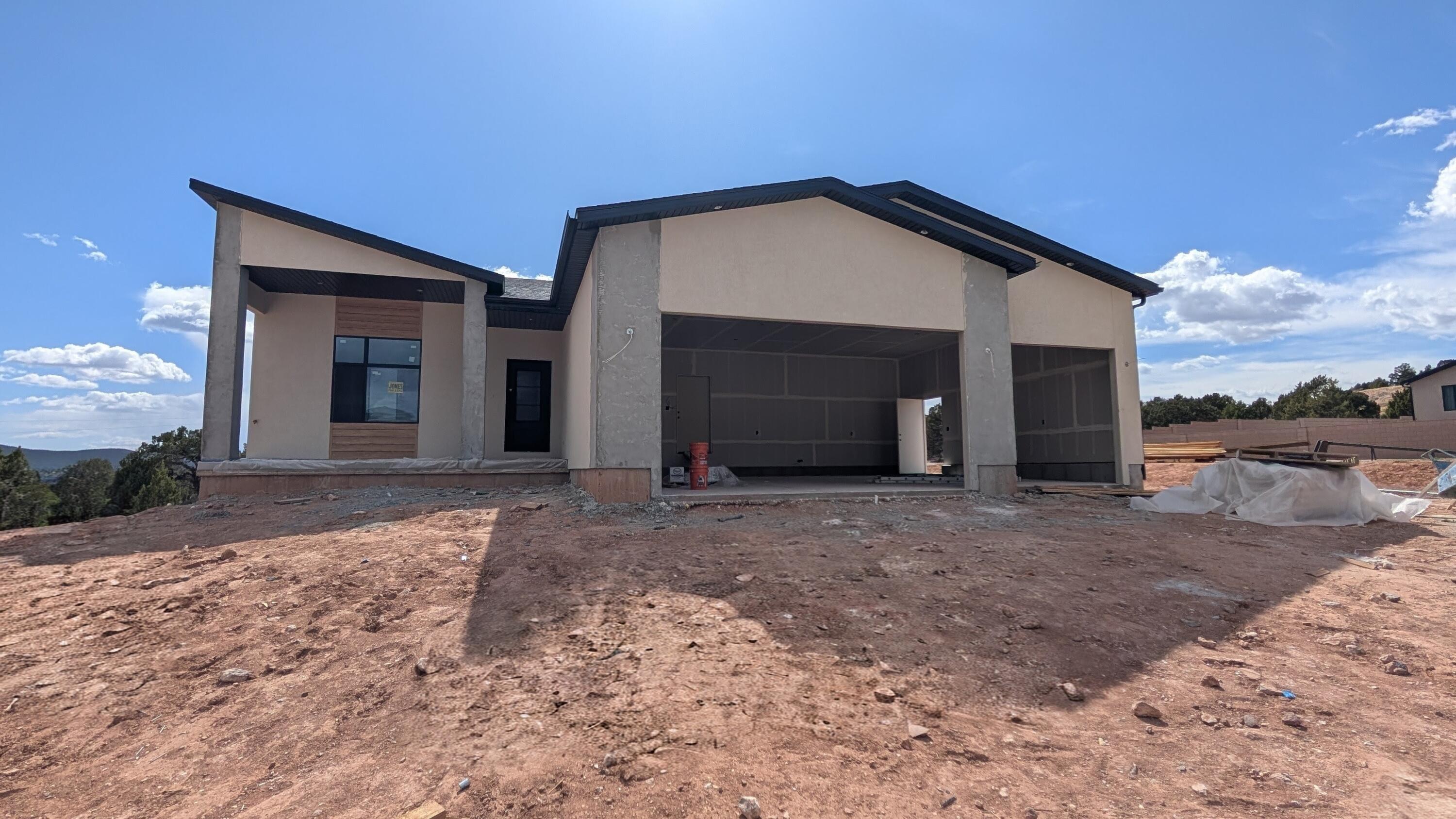 PRESALE-Modern style meets smart design in this Belmont floor plan by Hyve Homes in the highly sought-after South Mountain area of Cedar City. The exterior showcases a striking blend of stone, stucco, & siding, set against scenic Shurtz Canyon views. The daylight walkout basement includes a private 1-bedroom ADU with its own entrance, full kitchen, living & dining area, and bathroom--ideal for guests, multi-gen living, or rental income. Potential to expand into a 2-bedroom ADU by incorporating the adjacent bedroom. Enjoy 9-ft vaulted ceilings, a gourmet kitchen, a deck with spiral staircase, covered front porch, deep garage, and no-HOA community with fiber internet--minutes from town, near Zion National Park, Brian Head Resort, and Sand Hollow State Park, with St.George just 45 min south.