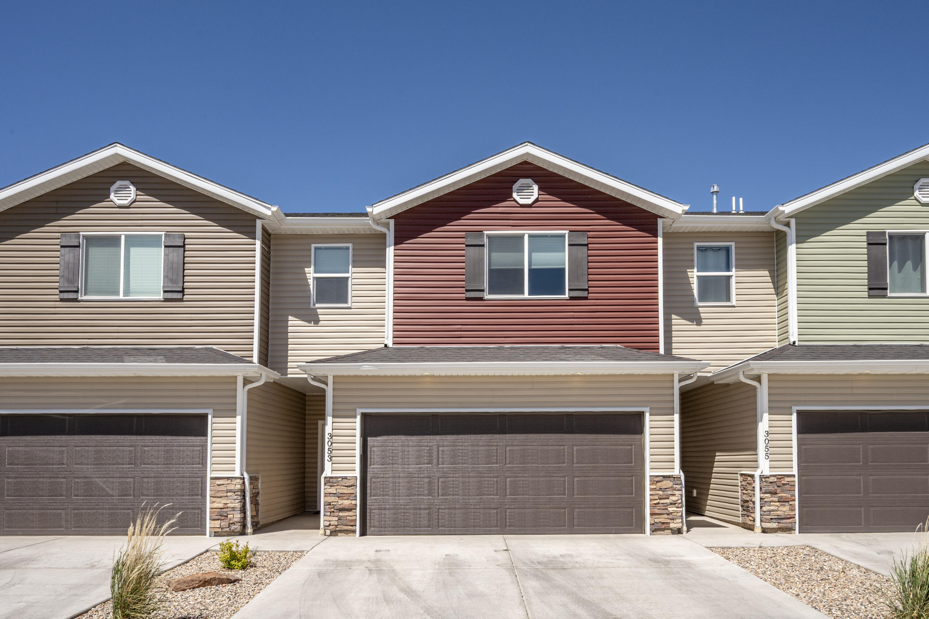 Discover a stunning townhome that combines the charm of a custom home with affordability. It features 9 ft. ceilings on the main level, luxury vinyl plank flooring throughout the main floor and bathrooms, with upgraded carpet in the bedrooms and upstairs hallways. The kitchen is equipped with stainless steel appliances, a gas range, quartz countertops, a subway tile backsplash, and soft-close cabinets. The living room showcases a shiplap accent wall and stylish lighting. The master bathroom includes his and her sinks. Comes with a two-car garage and a fenced backyard with a covered patio. Don't miss your chance--call today to schedule a showing!