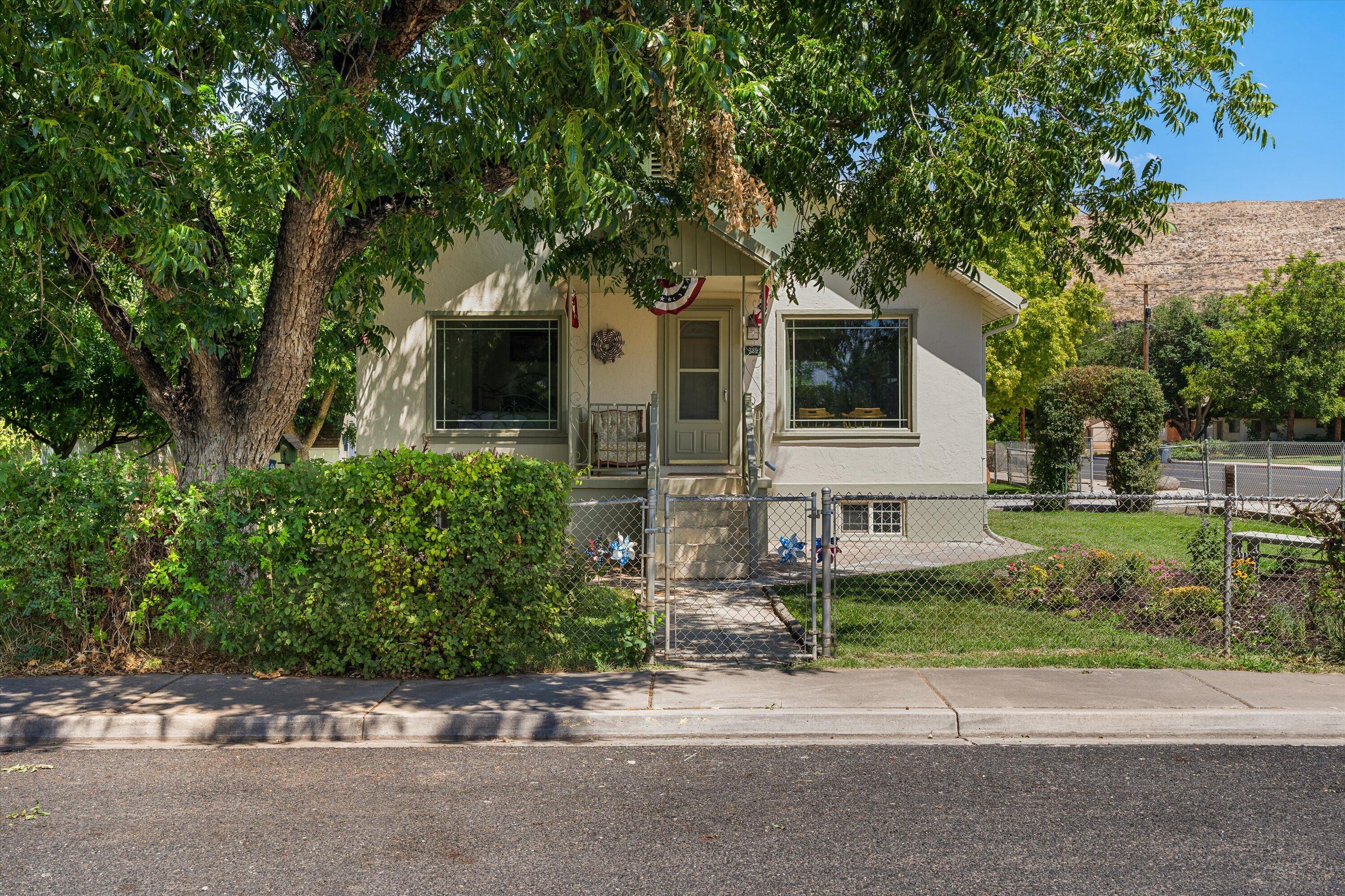 Completely remodeled from top to bottom on a spacious 0.21-acre corner lot in Hurricane's historic south end, this beautifully updated home combines timeless finishes with the charm of an established neighborhood.

Just a few blocks from Hurricane High School, you'll enjoy large, mature shade trees, no HOA, RV parking, and room to add a detached garage or casita. This home offers four bedrooms and two beautifully remodeled bathrooms with more living space than you might expect. The extensive renovation includes a remodeled kitchen with new cabinetry, countertops, and appliances, updated plumbing and electrical, fresh interior and exterior paint, and multiple new HVAC systems for year-round comfort.

The fully fenced yard surrounds the entire property and features a sliding entry gate, creating a secure space where kids and pets can play while still providing convenient access for vehicles, trailers, or RV parking. The detached shed is a blank canvas, ready to be transformed into a workshop, hobby space, home office, gym, additional bedroom, or storage--whatever best fits your lifestyle.

So if you're looking for charm & character, but with the feel of a new home then this is the one. Don't miss your opportunity to own this beautifully renovated gem!