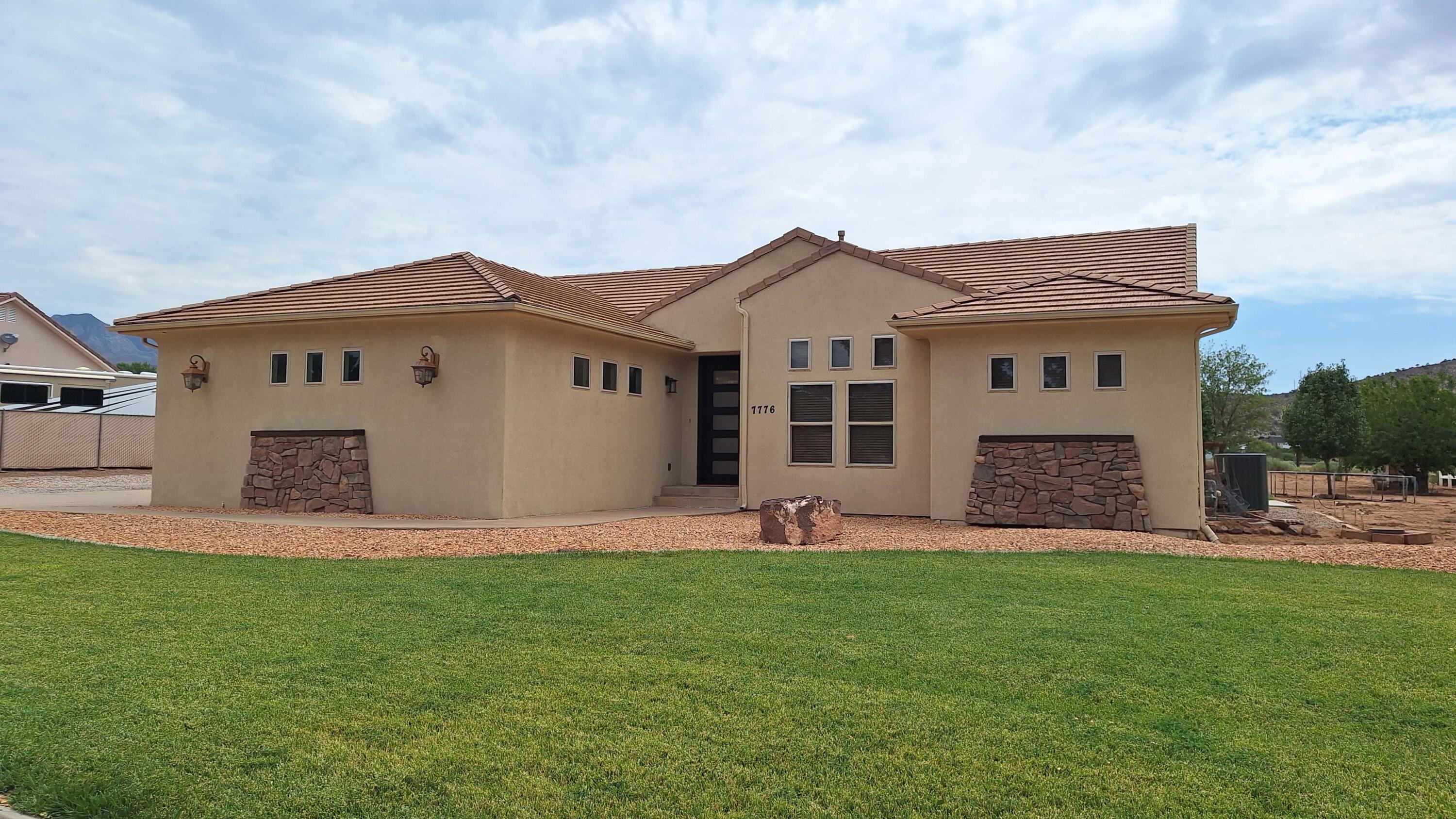Experience the perfect blend of country living and modern comfort in this beautifully maintained home in Diamond Valley. Enjoy peaceful surroundings, cooler temperatures, and stunning panoramic views--all while being just minutes from town. Situated on horse property, this spacious 5-bedroom, 3.5-bath home offers exceptional versatility, quality finishes, and thoughtful updates throughout. Designed with both style and functionality in mind, the home features 10-foot ceilings, newer appliances, and a charming wood-burning stove that creates a warm and inviting atmosphere. The finished lower level adds incredible flexibility with luxury vinyl plank flooring, individual mini-split systems in every room, a large fitness or recreation area, dedicated office or workspace, abundant storage, and plumbing already in place for a future second kitchen--making it ideal for multigenerational living, guests, or extended entertaining. Step outside to enjoy the thoughtfully designed outdoor living space, complete with a pergola-covered patio, timed irrigation for the garden area, and established fruit trees, blackberries, raspberries, and mint. Whether you're relaxing with family or entertaining guests, you'll appreciate the peaceful setting and breathtaking views. A standout feature of the property is the impressive 30' x 60' detached shop with 220-volt power, a Trex deck, and an unfinished loft already equipped with water and power, offering endless possibilities for a workshop, hobbies, additional storage, or future living space. Additional highlights include a new front door, low utility costs, and numerous updates that enhance the home's comfort, efficiency, and functionality. Buyer to verify all information, including square footage, utilities, rental restrictions, and HOA information, if applicable. Information is deemed reliable but is not guaranteed.