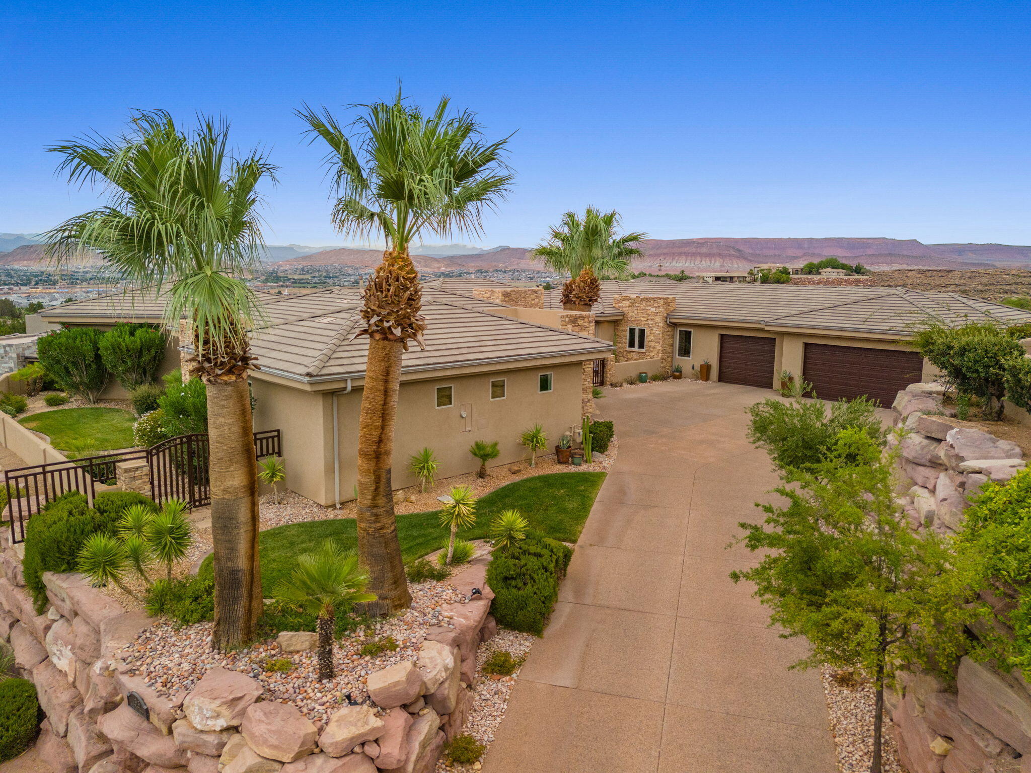 New price! One of the best views in all of St. George with sweeping panoramic views, private backyard, immaculate single-level 4100 sq ft home with new pool and spa now under $2M including resort-style amenities with 24X7 guard gated security!

Wake up every day to views stretching from the red mountains of Snow Canyon, City of St George, Pine Valley mountains, Zions to Crimson Cliffs. Owners have invested over $200,000 in major upgrades and enhancements over the past few years to modernize this beautiful single-level luxury custom home in 24x7 guard-gated Stone Cliff.

Quiet and fully private front to back, this home offers seamless indoor-outdoor living just steps from the brand-new pool and spa. Enjoy a spacious primary suite and bath, while guests experience full ensuite bathrooms or the comfort of the private casita.

Ideally located just minutes from Black Desert, Sand Hollow, and other premier golf courses, Snow Canyon hiking, Tuacahn Amphitheatre, restaurants, shopping, and only a 13-minute drive to St. George Regional Airport.

From sunrise to sunset, the breathtaking views and resort-style living will leave both you and your guests in awe every single day. See Floor Plan in photo section & 3D Matterport 
New front-loading washer, dryer & furniture (negotiable)
Very Low Monthly Average Utilities
Enbridge Gas: $75.29
St. George Utilities (water, sewer, trash): $146.79
Dixie Power: $177.35