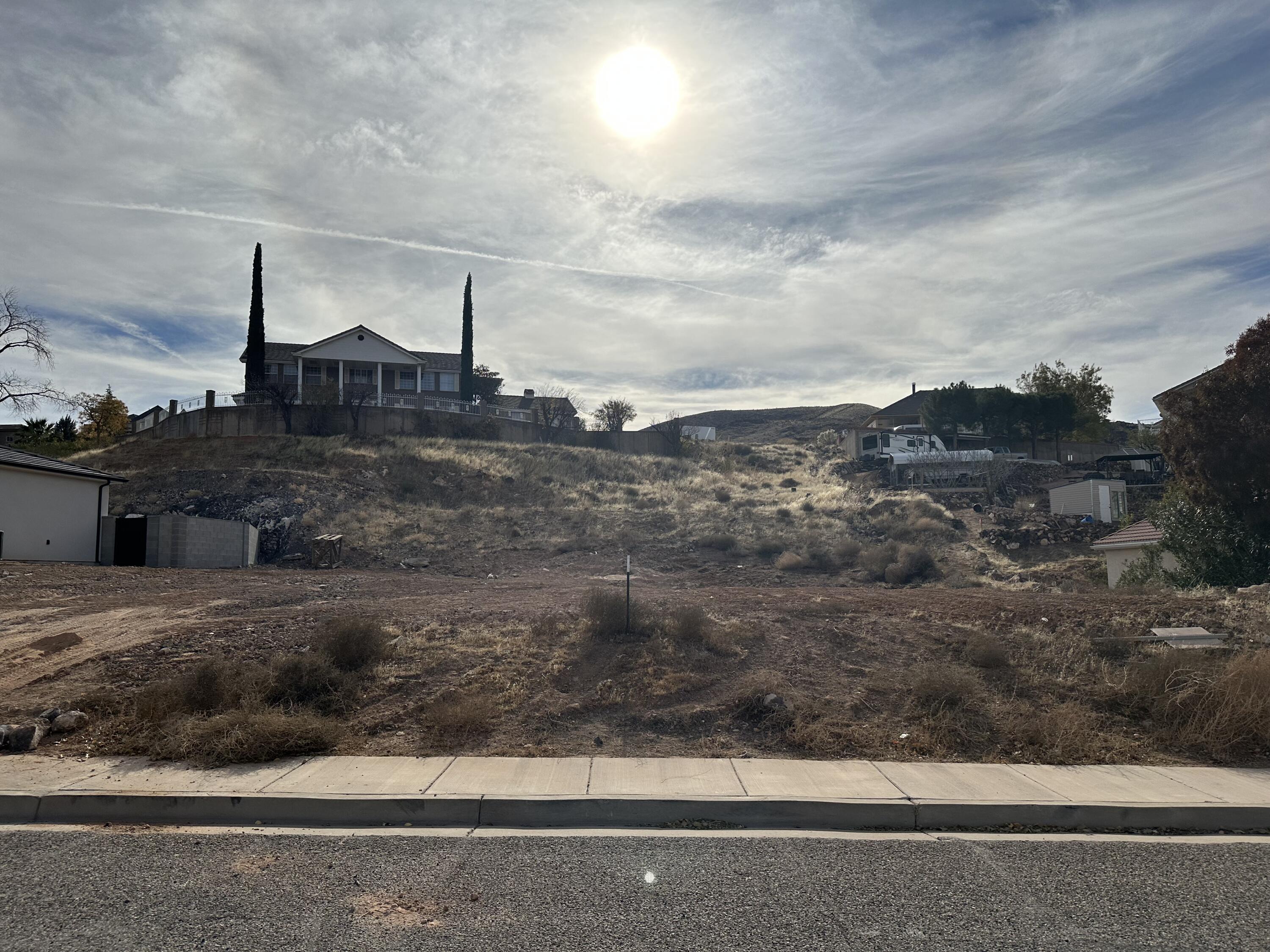 Beautiful .29 acre lot in a very nice established neighborhood with NO HOA FEES. Great location with some views. Bring your own builder for the custom home of your dreams. Perfect location close to Sand Hollow Reservoir, Sand dunes, Quail Creek Reservoir, shopping centers, Healthcare and so much more.