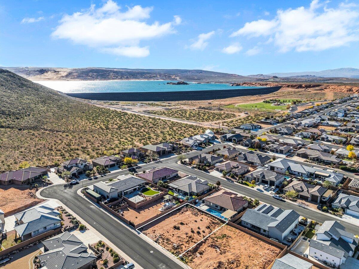 Build your dream home on this .23-acre lot in Dixie Springs, offering a perfect blend of convenience, adventure, and stunning natural beauty. Enjoy picturesque mountain views, no HOA, and utilities already at the lot, making it truly ready for your custom build. Ideally located just minutes from Sand Hollow Reservoir, Sand Mountain dunes, Dixie Springs Park, and nearby shopping, convenience stores, and restaurants, this spot puts everything you need within easy reach. Outdoor enthusiasts will appreciate year-round access to boating, off-roading, hiking, pickleball, and direct SXS access from your garage to world-class trail systems. With close proximity to Zion National Park, top-rated golf courses, and iconic red rock landscapes, this lot offers an exceptional opportunity to live at the heart of Southern Utah's most treasured recreation and scenery. Buyer to verify all information, deemed reliable, however buyer to verify all info including utilities, rental restrictions, and HOA information if applicable.