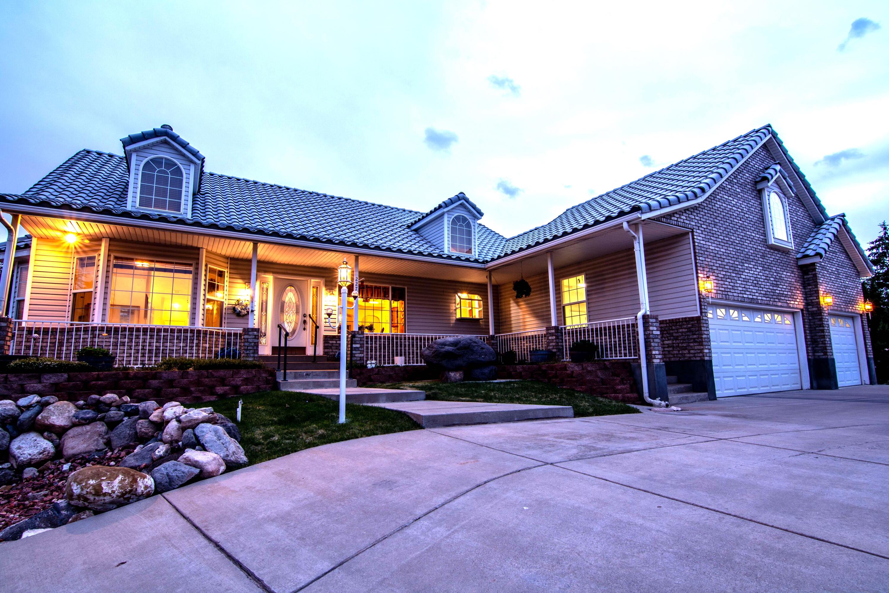 Perched on an elevated corner cul-de-sac lot in one of Cedar City's established premier neighborhoods, this well cared for multi-level home offers sweeping views and a charming outdoor setting. Featuring 2 separate garages and a flexible basement layout, this home has easy ADU potential. The outdoor spaces are exceptional - the beautifully landscaped yard showcases creative design elements with inviting gathering spaces, and a charming gazebo patio area perfect for relaxing or entertaining. Rarely does a property combine this level of location, views, and opportunity in one package. Bring your ideas and transform this standout property into something extraordinary.