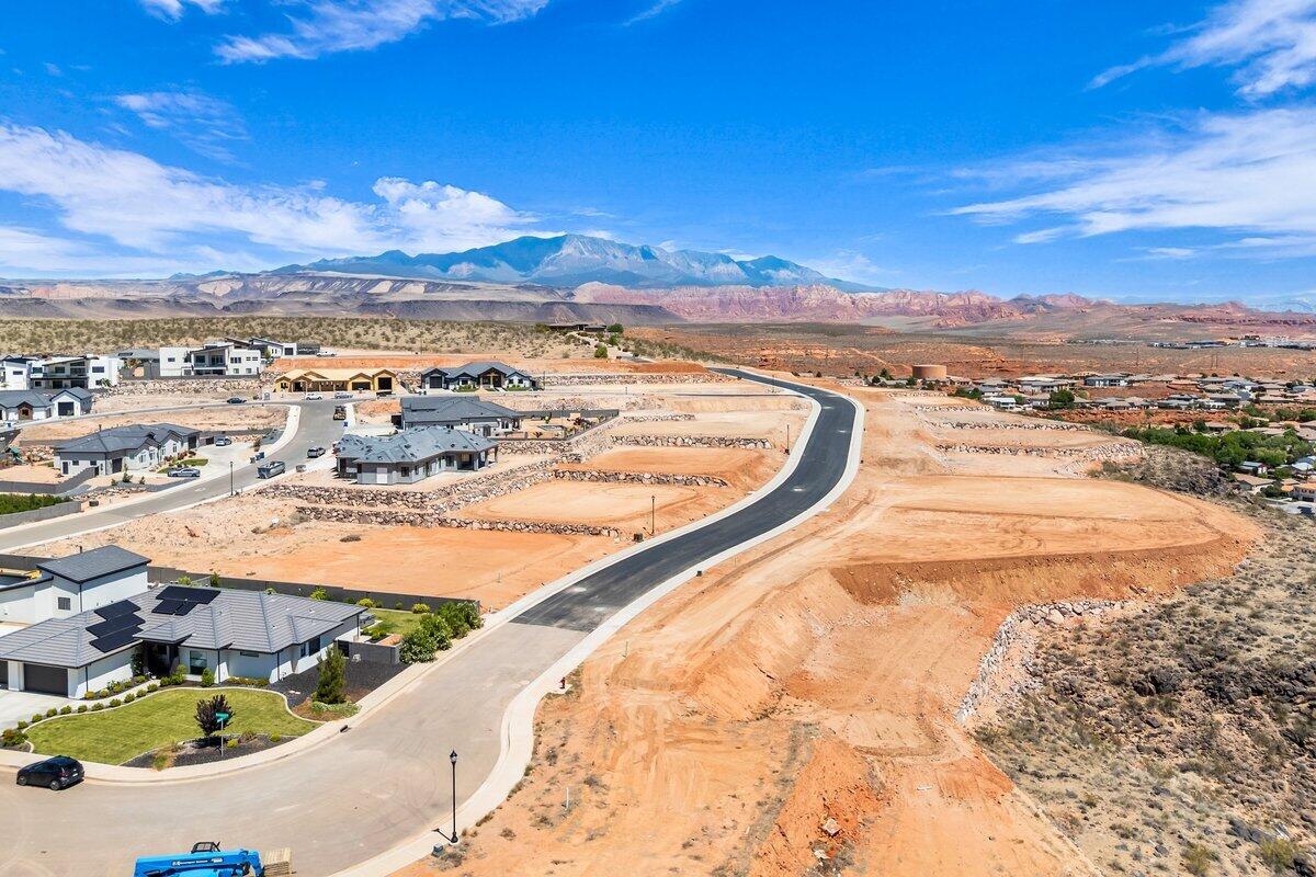 Interior view lot with exceptional views overlooking the city, mountains, Pine Valley, red rock mesas, Sand Hollow, and even Zion National Park! Best suited for a rambler floor plan, this lot is located in the final phase of Grand Heights, the highest elevated subdivision in St. George proper, nearly 500 feet higher than the rest of town, including Stone Cliff and Foremaster, offering unmatched views. Enjoy quick access to downtown, hiking and biking trails, and off-road adventures, plus you're just 15 minutes from two major fishing reservoirs and over half a dozen top-rated golf courses. With BLM land bordering the subdivision, you can ride bikes and ATVs straight from your doorstep. Numerous oversized lots are available with convenient highway access. Bring your own builder! Buyer is responsible for water impact fees. All construction requires prior review and approval by the architectural control committee. Buyer to verify all information, deemed reliable, however buyer to verify all info including utilities & ACC information if applicable.