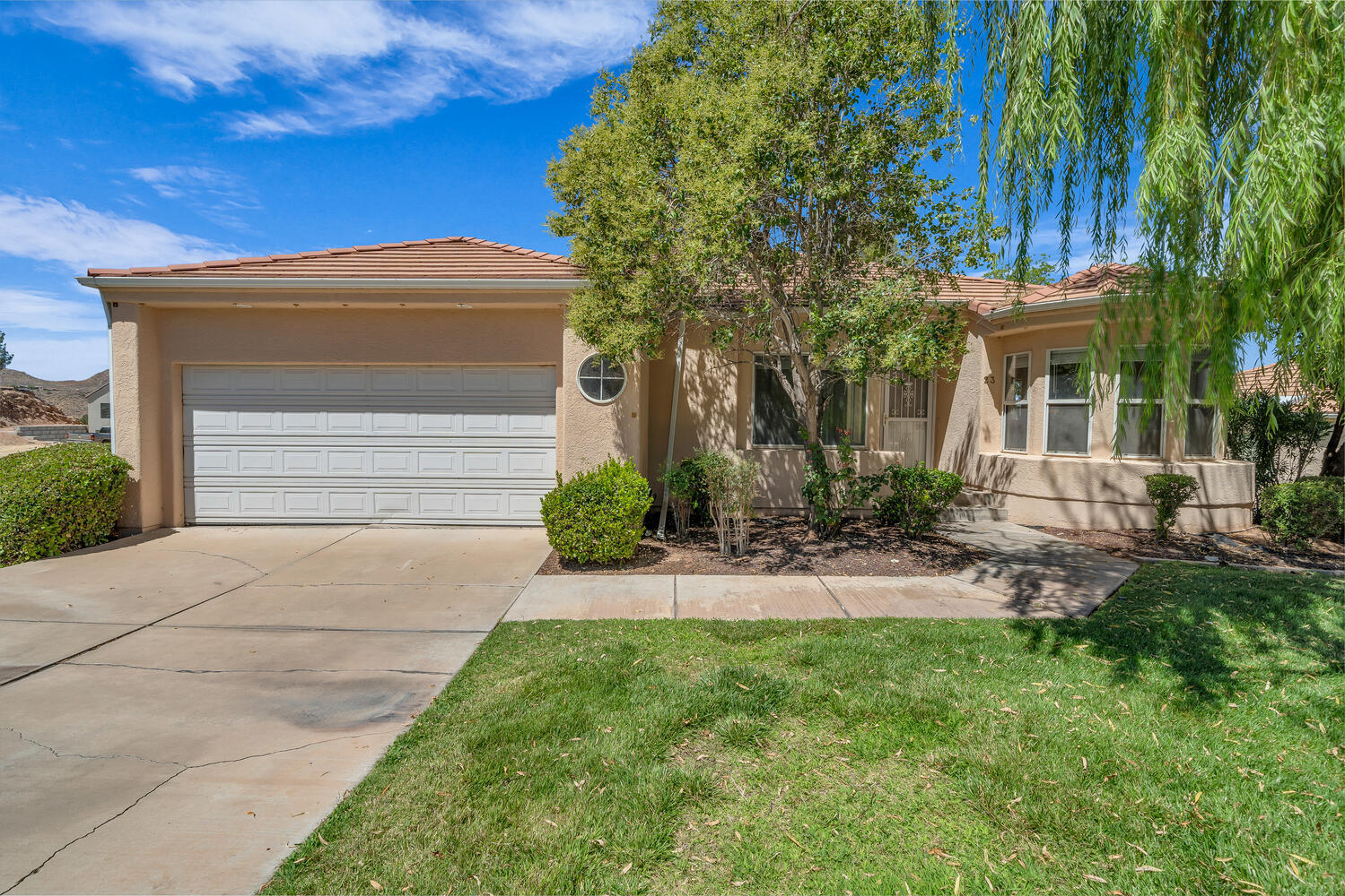 Unattached single-family home with a walk-out basement has GREAT VIEWS & BONES. Seller will consider concessions for a rate buy-down or upgrade allowances. From it's extended back patio with opportunity for amazing mountain & City of St George Golf Course views to it's multi-level layout, this is a house for the generations. Enjoy 3,304 square foot, 5 bedrooms on a corner lot. Master bedroom is on the main floor. A gathering space on both the main level & finished basement allow for peace and quiet for some while others are entertaining or playing. AND the HOA boasts a pool, jacuzzi, rec room, and tennis courts! Huge storage room, and a bonus room that could be turned into a movie theatre. Close to Hospital, Golf Course, and Shopping. Immediate occupancy! Call  today for a private showing