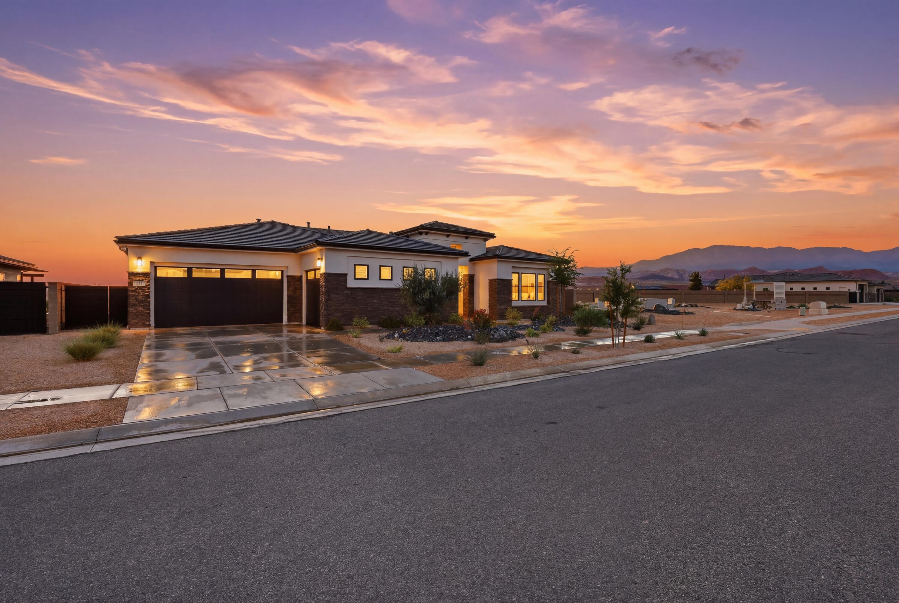 Presenting 81 N Highland Parkway, a meticulously maintained luxury home located in the highly sought-after Views at Coral Canyon community in beautiful Washington. Perched on a scenic mesa with breathtaking panoramic views, this like-new home offers a unique blend of luxury, comfort, and Southern Utah living.
Built in 2023, this thoughtfully designed 2,572 square-foot home features 4 spacious bedrooms all with beautifully appointed ensuite bathrooms. 10-foot ceilings, abundant natural light, and an expansive multi-panel sliding door create a bright, open atmosphere that seamlessly blends indoor and outdoor living.  A well-appointed, gourmet kitchen flows seamlessly to the great room, which features a contemporary linear fireplace surrounded by stylish built-in shelving and cabinetry.
The backyard retreat features a sparkling heated pool, a contemporary fire feature, private seating areas, a covered dining area and spectacular views overlooking the St. George area -- perfect for entertaining or relaxing under the desert sky. Bordering a community common area, the property enjoys added openness for even greater views.  The  3-car garage with two mini-split units provides year-round comfort and flexibility.
Residents enjoy outstanding Coral Canyon amenities including parks, pickleball courts, walking trails, green space, a community lap pool and year round hot tub.  Conveniently located near Sand Hollow Reservoir, Zion National Park, world-class golf, shopping, dining, and freeway access, this home truly offers the best of Southern Utah living.