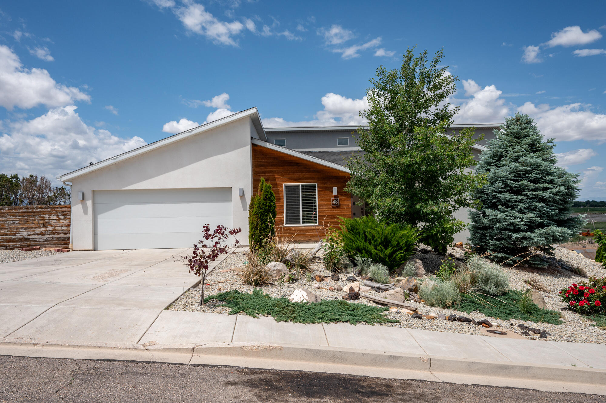 48 S Cimarron Circle is a 6-bedroom, 3,148 sq ft rambler in Cedar City, Utah, built in 2015 with a daylight walkout basement that opens to the backyard. On a quarter-acre lot in a quiet west-side Iron County neighborhood, this home has a covered deck, wood stove, full fencing, auto sprinklers, and RV parking. The main level features an open-concept kitchen, vaulted ceilings, a main-floor primary suite with walk-in closet, and laundry. Downstairs adds three bedrooms, a large family room, and real storage. The flex room is what sets this one apart. It has its own exterior entry and works as a home office, studio, guest suite, or private rental space, separate from the rest of the house. Furniture included. Move-in ready. Listed at $549,000 in Cedar City, Utah, with easy access to I-15, schools, shopping, and the national parks, skiing, and hiking that make Southern Utah worth living in.