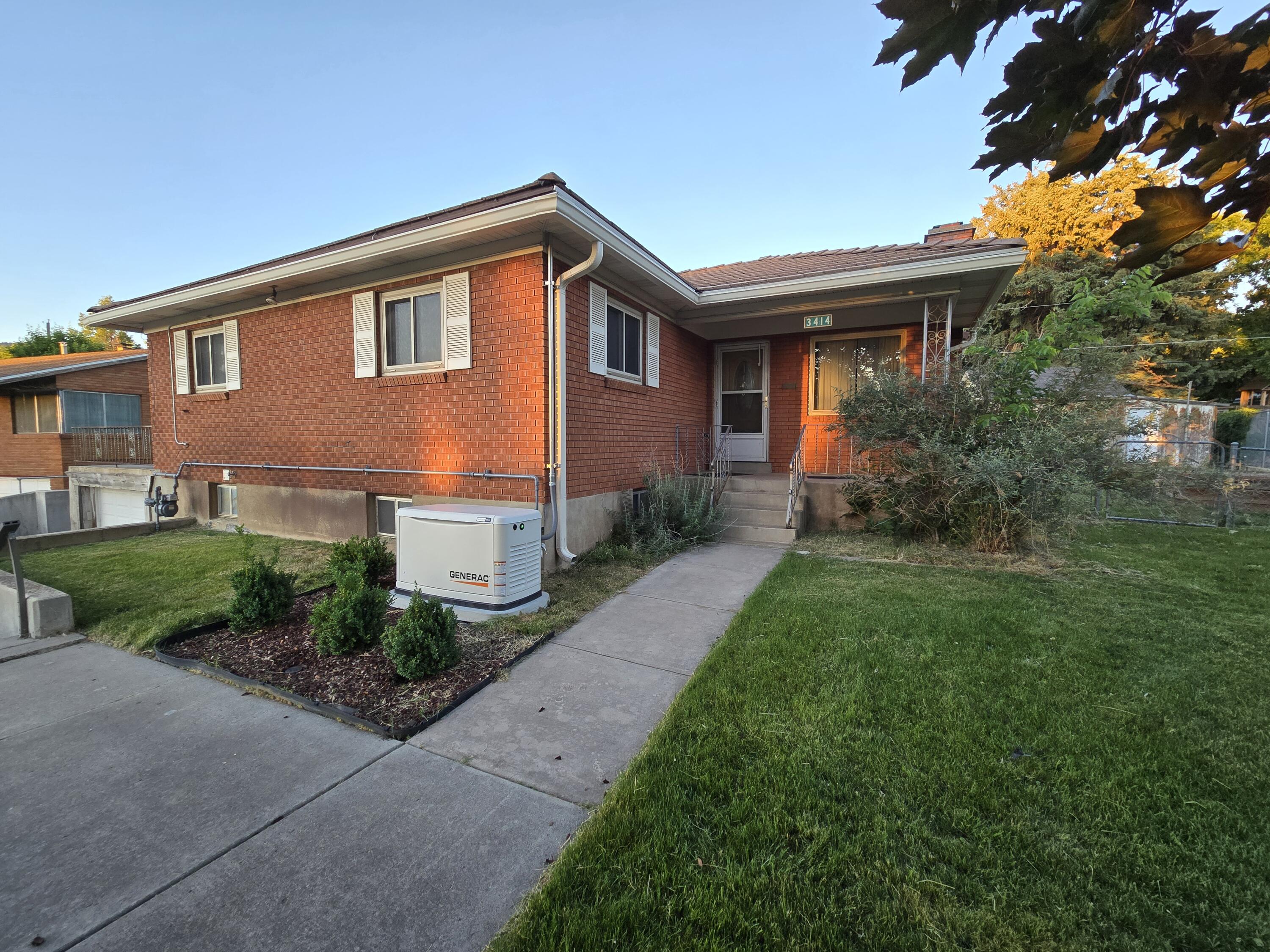 This home has two kitchens and a private entrance to the basement. The main living room has large windows letting amazing light from the East and West. The upstairs kitchen and bathroom have been remodeled. The yard has all mature landscaping and trees, raised garden beds, a greenhouse and large shed. New heater and AC units in 2019. If you're into being disaster ready, the on demand Generac natural gas power station is all set up. This home needs flooring paint and one more bathroom remodel. Being near Weber State University this could be your next amazing investment.