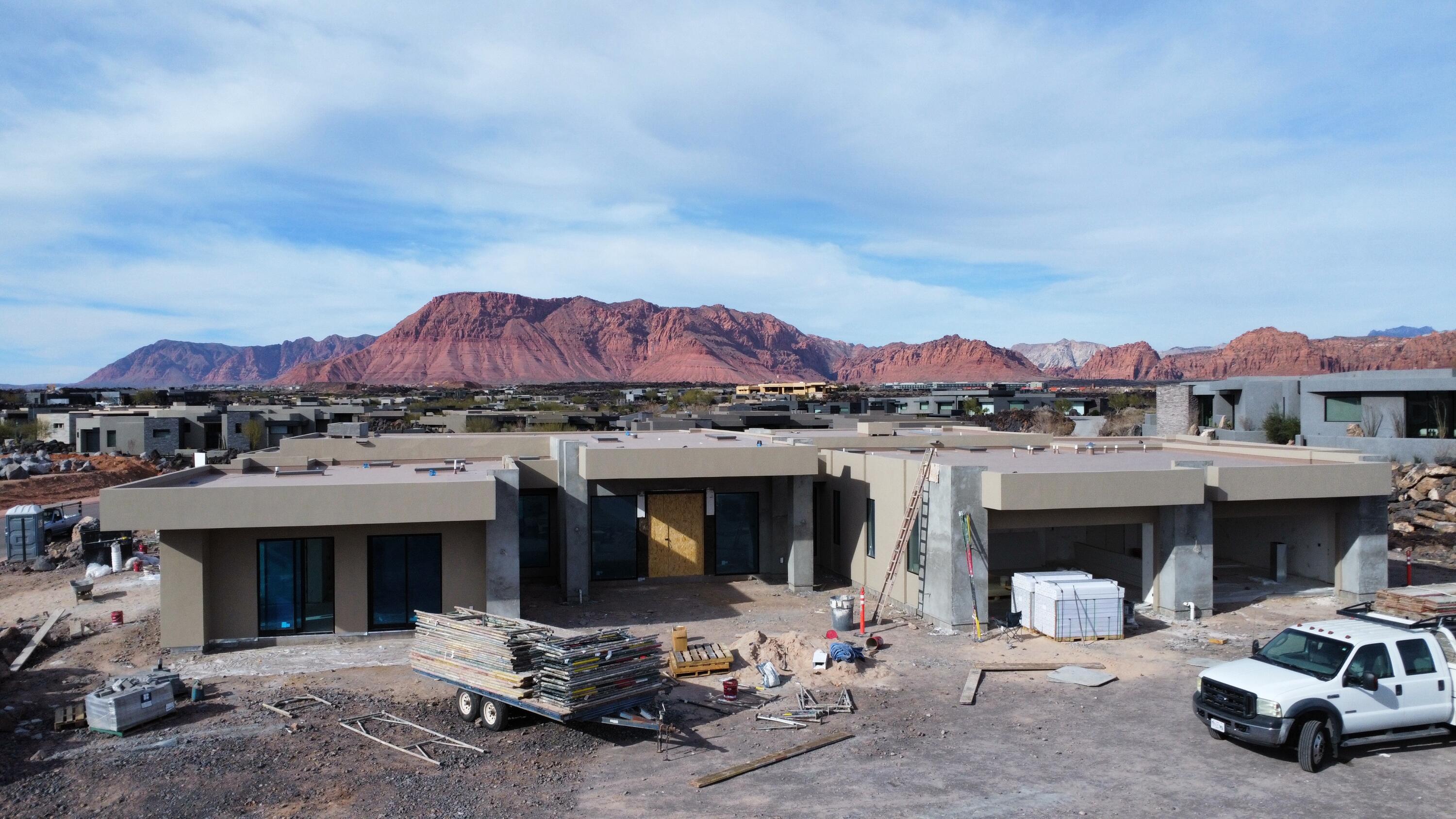 Experience the pinnacle of desert luxury in this stunning Split Rock custom 5,205 sq. ft. residence, perfectly positioned in the exclusive Entrada community. With dramatic Red Rock and Snow Canyon views as its backdrop, this home captures the essence of Southern Utah living.

Offering 4 spacious bedrooms, 4.5 baths, and a 4-car garage, every detail has been crafted with sophistication and comfort in mind. The open-concept design flows seamlessly, with expansive windows framing the breathtaking scenery and filling the home with natural light.

Step outside to your private resort-style retreat, where a sparkling pool, multiple lounge areas, and thoughtfully designed outdoor entertaining spaces invite both relaxation and celebration. Also has a pool half bath. Whether hosting guests under the desert sky or savoring quiet moments surrounded by nature, this home offers an unparalleled lifestyle.

Blending architectural elegance with modern amenities, this Entrada estate is more than a home, it's a sanctuary of beauty, privacy, and timeless design.