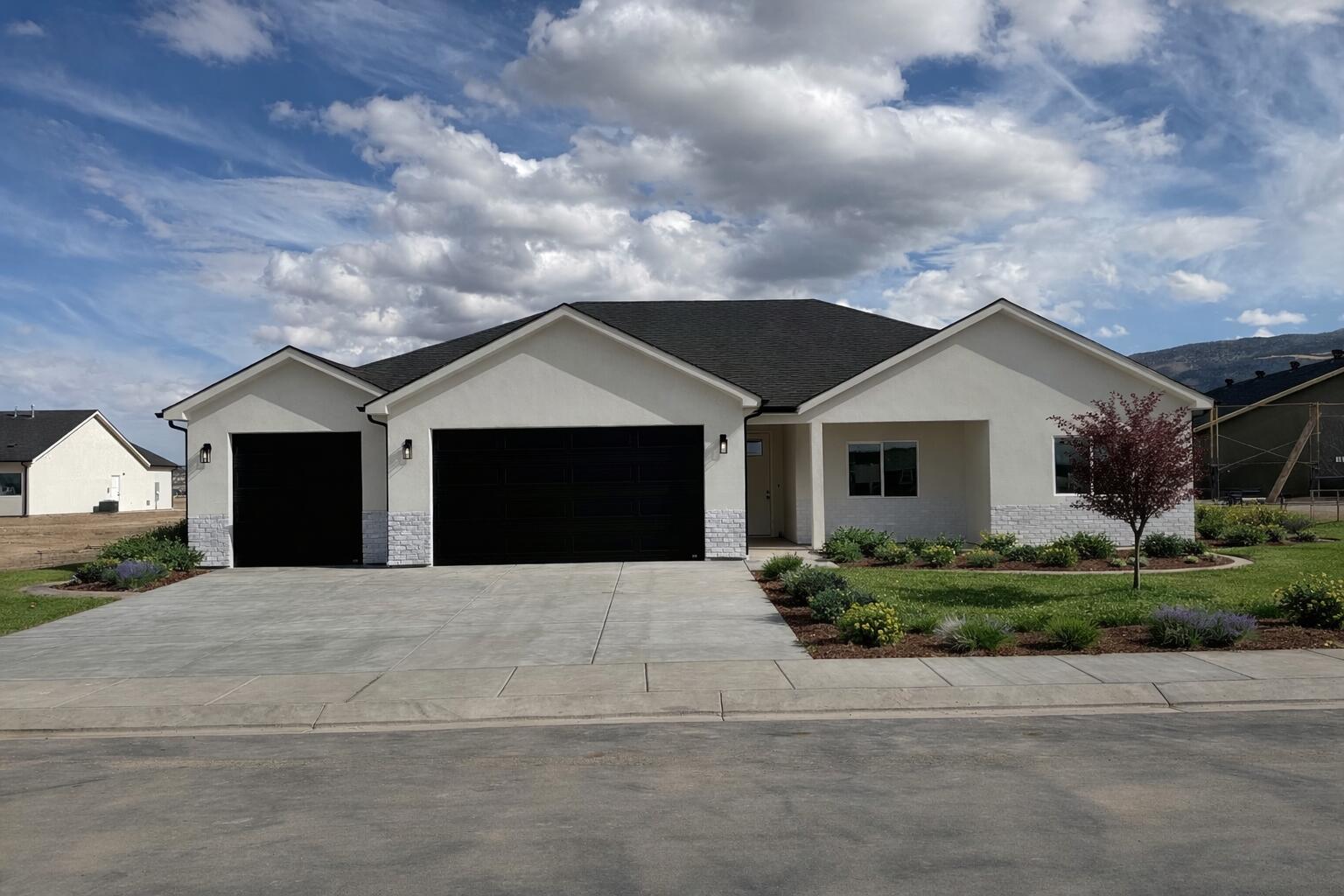 NEWLY FINISHED!!! Sellers are offering $4K in Closing Costs when buyers use Coal Creek Mortgage. AI used to show potential landscape. 
Located in the beautiful new Valley Gate subdivision, this modern home offers comfort, convenience, and small-town living. Just minutes from the elementary school, shopping, and other local amenities, this home puts everything you need right within reach. Step inside to an open floorplan with natural light, quality finishes, and thoughtful details throughout. The kitchen flows seamlessly into the living area perfect for gatherings or entertaining. Large bedrooms and a well-designed layout make this home ideal for families. One of the standout features of this property is the oversized 3-car garage with an extended storage area.
