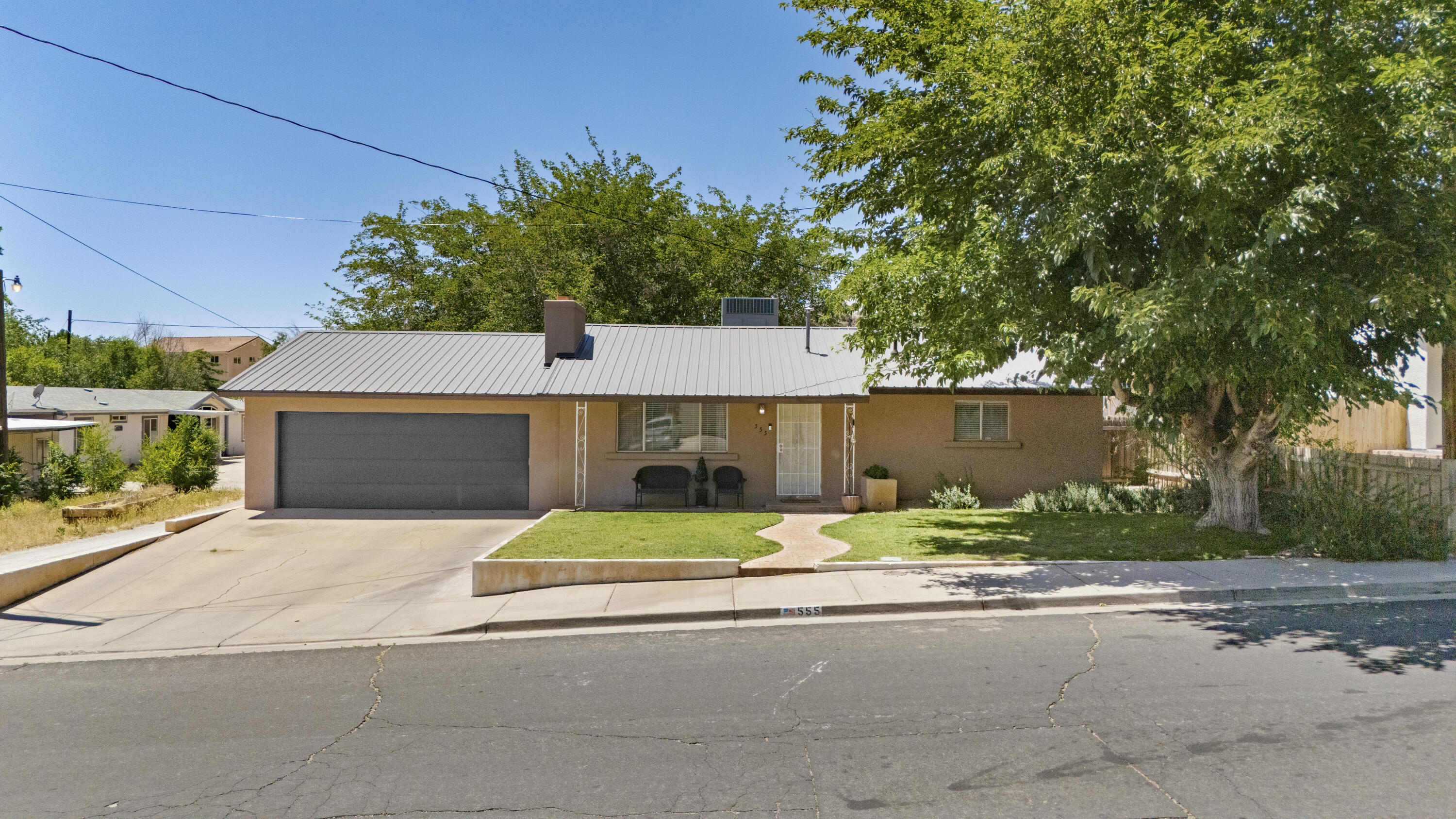 Prime opportunity in the heart of Hurricane! Situated on .39 acres right on Main Street, this super clean and well-maintained property offers endless possibilities for homeowners, investors, or anyone looking for space in a prime in-town location. The home features painted kitchen cabinets, updated countertops, a new water heater, and an added family room in the basement for extra living space and flexibility. Outside, you'll find mature landscaping, fruit trees, a fully fenced yard, and a barbecue pit on the rear portion of the property perfect for weekend gatherings, entertaining, or enjoying your own private outdoor retreat. The rear lot may offer future split and build potential, creating exciting rental income or development opportunities. Conveniently located close to schools, shopping, parks, and everyday amenities, this is a rare chance to own a versatile property with room to grow in one of Southern Utah's most desirable communities.