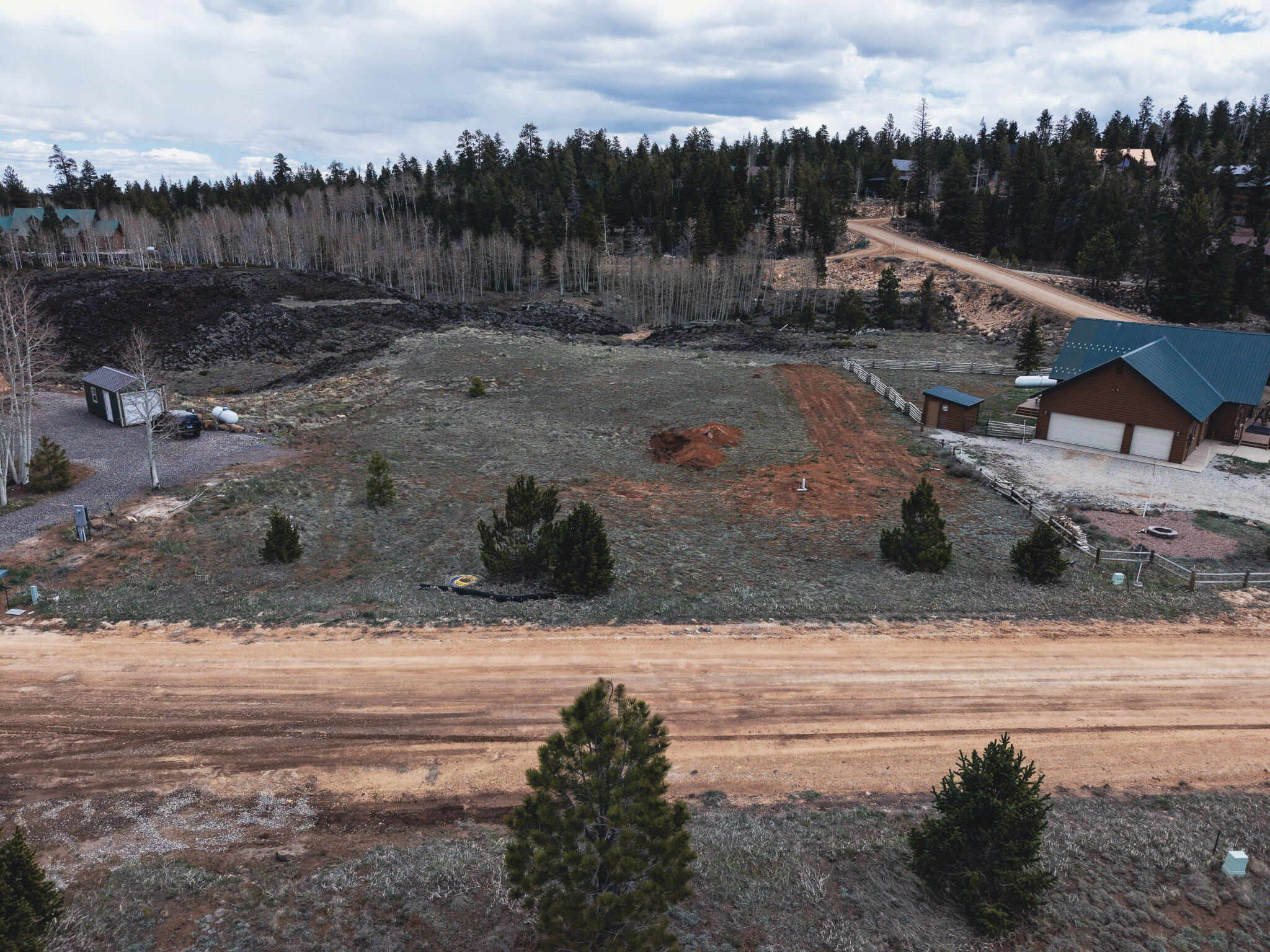 Tucked away in the highly desirable Lost Creek Subdivision of Duck Creek Village, this .72-acre lot is the perfect opportunity to build your dream mountain cabin without starting from scratch. Surrounded by towering pines and natural beauty, this property offers a peaceful, private setting with year-round access and views in every direction. What truly sets this lot apart is that much of the groundwork has already been completed. A septic system is already installed, the water impact fee has been paid, and HOA-approved building plans are in place for a thoughtfully designed 1,400 sq ft cabin--saving you time, money, and the headache of the approval process. Power and city water are available, making this a rare, build-ready opportunity in one of Southern Utah's most sought-after