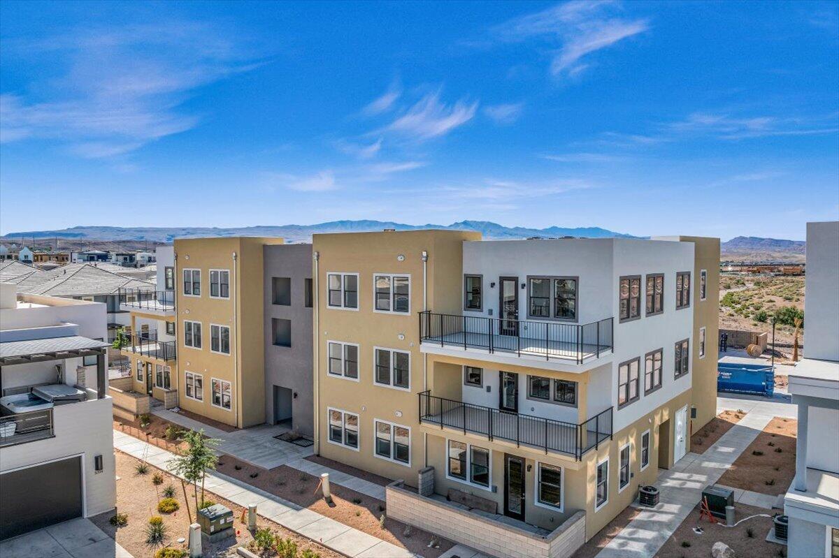 Price Improvement -- Move-In Ready 3 Bedroom Resort Condo! Experience resort-style living in the heart of Desert Color with this beautifully designed Holmes Homes-built 3 bedroom, 2 bathroom resort condo, perfectly situated on the second floor. Thoughtfully designed for both personal enjoyment and nightly rental potential, this residence features an open-concept living space, a stylish kitchen and dining area, and designer finishes throughout. Enjoy all that Desert Color has to offer, including the 2.5-acre lagoon, resort pools and hot tubs, pickleball courts, snack shack, and more. Located just moments from the community's premier amenities, this condo is ideal as a low-maintenance vacation getaway or income-producing investment.