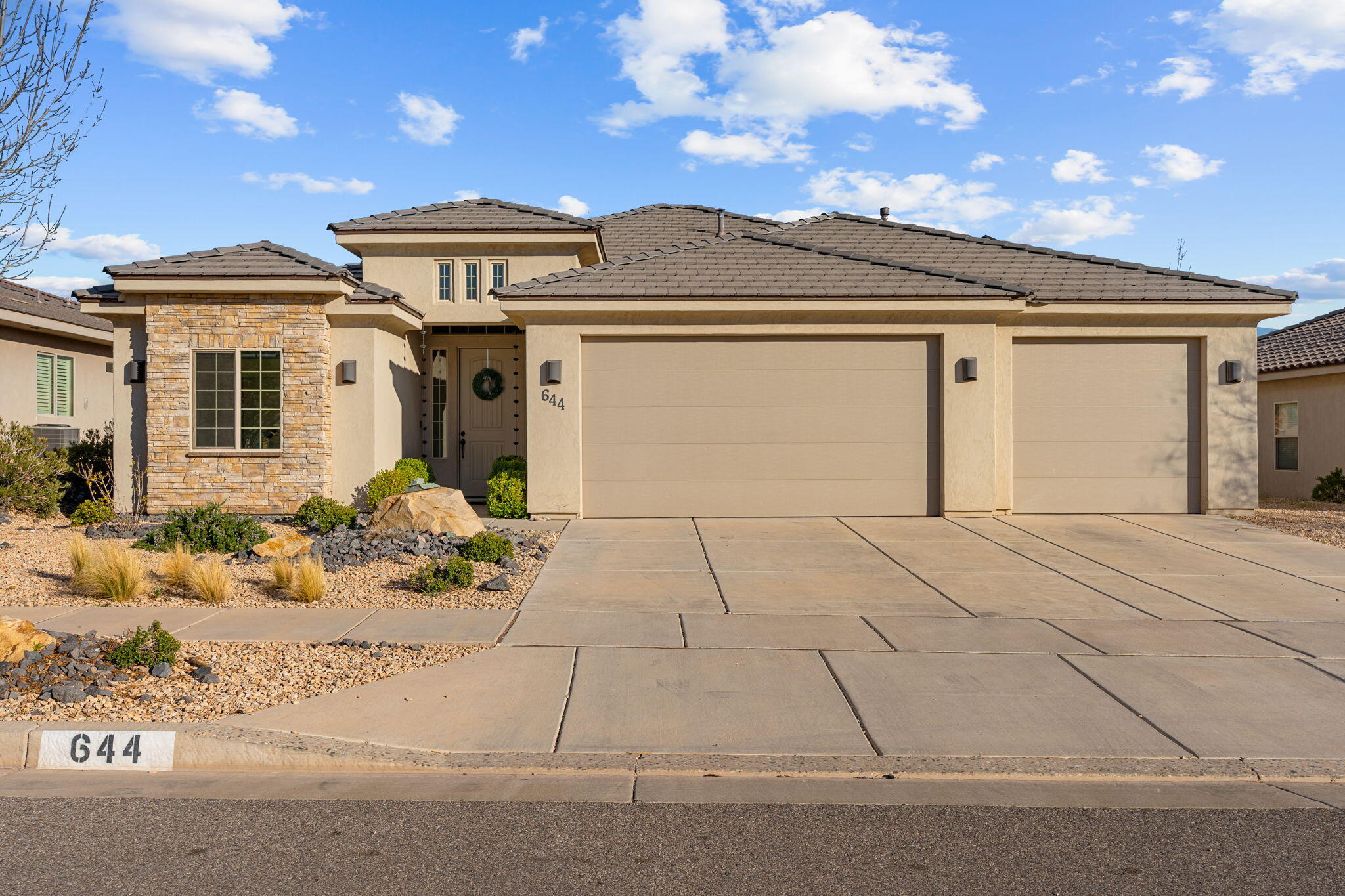 Located in Sienna Hills, this single-level home offers 4 bedrooms, 2 bathrooms, and a 3-car garage with a layout that just makes sense. The vaulted ceilings and open living space make the main area feel bright and comfortable, with a great room that's perfect for everyday living. The primary suite is a nice retreat with two walk-in closets and a spa like bathroom with a large soaking tub. In the kitchen you'll find granite countertops and tall upgraded cabinets with plenty of storage. Out back, the yard is fully xeriscaped with quality synthetic grass for easy upkeep. Solar panels on the roof help with energy costs, and solar screens keep the home cooler during the warmer months. Easy access to shopping, schools , I-15 and everything St. George has to offer.