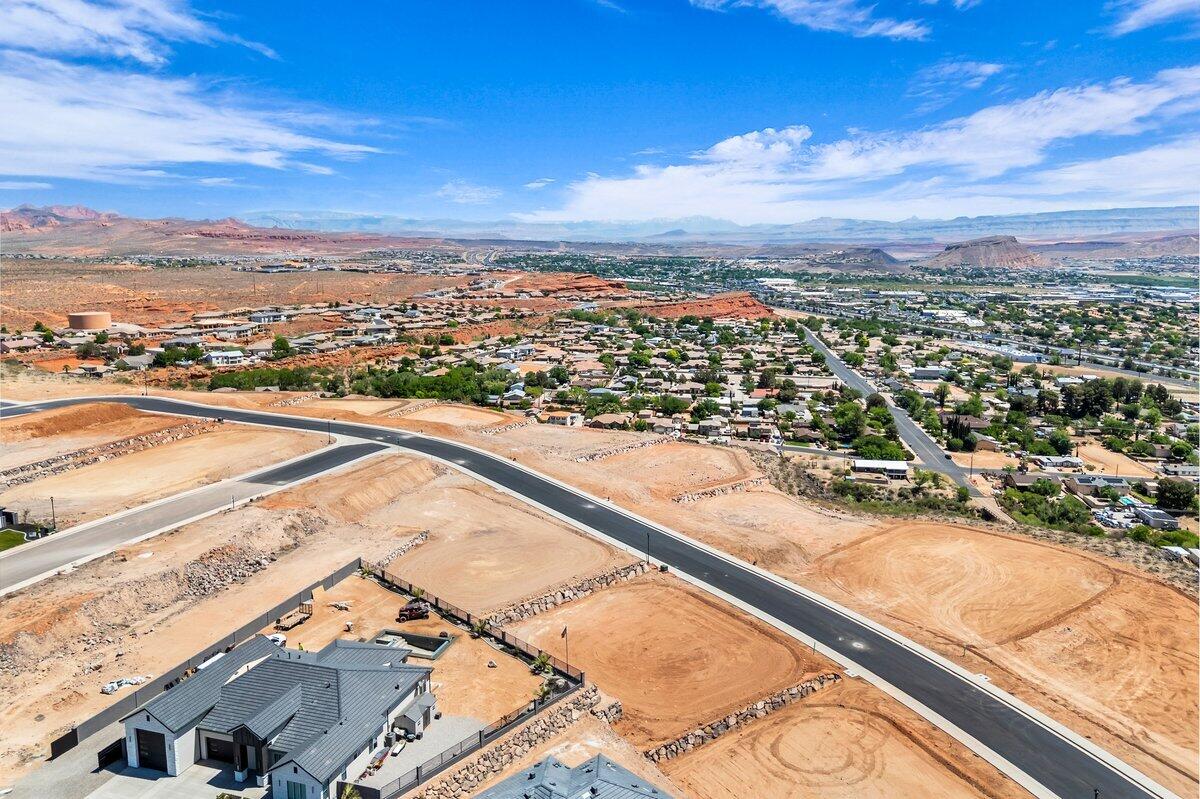 Interior view lot with exceptional views overlooking the city, mountains, Pine Valley, red rock mesas, Sand Hollow, and even Zion National Park! Best suited for a walkout floor plan, this lot is located in the final phase of Grand Heights, the highest elevated subdivision in St. George proper, nearly 500 feet higher than the rest of town, including Stone Cliff and Foremaster, offering unmatched views. Enjoy quick access to downtown, hiking and biking trails, and off-road adventures, plus you're just 15 minutes from two major fishing reservoirs and over half a dozen top-rated golf courses. With BLM land bordering the subdivision, you can ride bikes and ATVs straight from your doorstep. Numerous oversized lots are available with convenient highway access. Bring your own builder! Buyer is responsible for water impact fees. All construction requires prior review and approval by the architectural control committee. Buyer to verify all information, deemed reliable, however buyer to verify all info including utilities & ACC information if applicable.