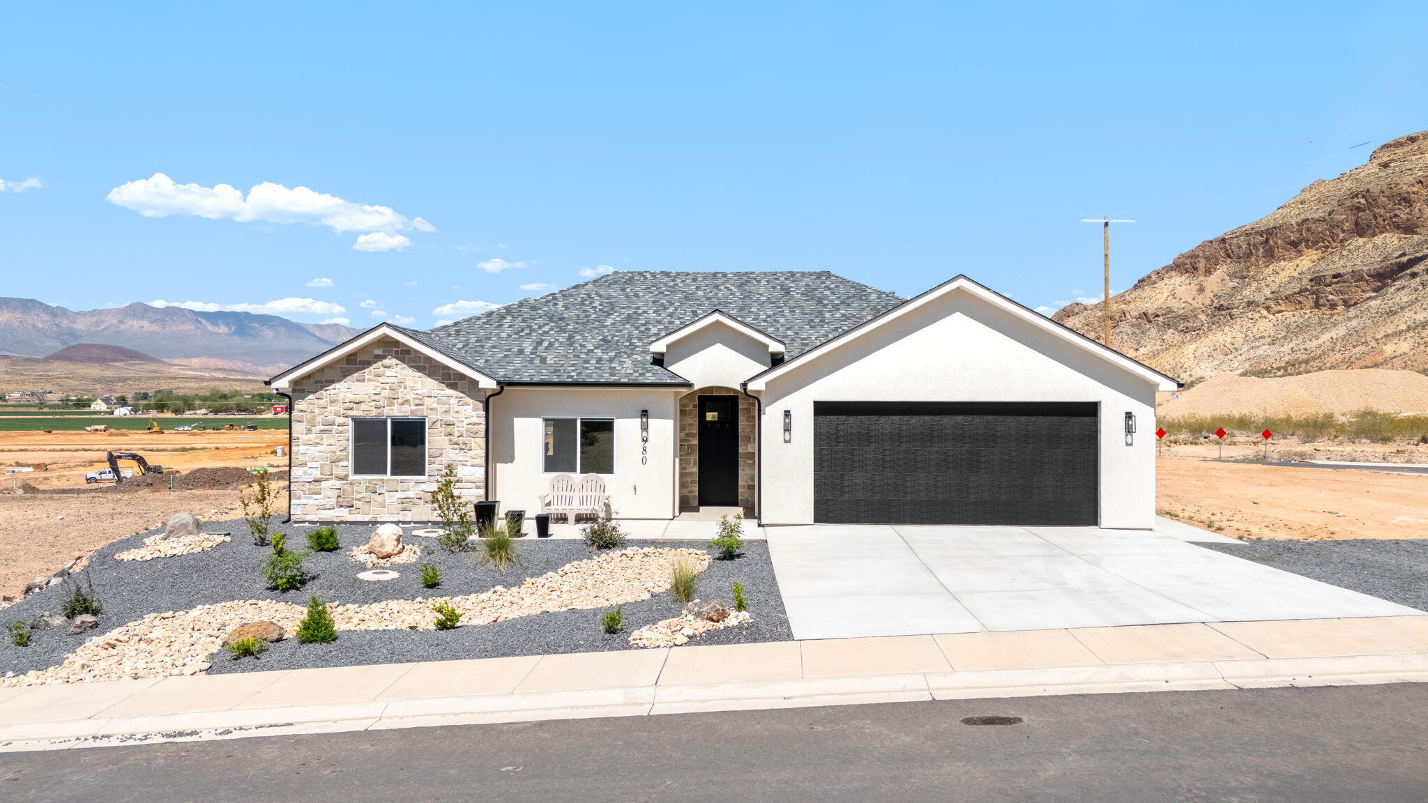 Perfectly situated on an expansive .4-acre corner lot, this exceptional single-level rambler showcases breathtaking panoramic mountain views, offering an unbeatable setting with no HOA! Inside, you'll find a spacious open-concept layout filled with abundant natural light and elevated by gorgeous modern finishes throughout. The thoughtfully designed floor plan flows seamlessly to a large, covered patio, perfect for relaxing evenings or entertaining while soaking in the stunning scenery. The oversized lot provides incredible potential to create your dream backyard oasis, with ample space for a pool, shop, or custom outdoor living retreat. Additional highlights include generous RV parking alongside the attached 2-car garage, all set within a desirable community just moments from world-class outdoor recreation! Buyer to verify all information, deemed reliable, however buyer to verify all info including utilities, rental restrictions, and HOA information if applicable.