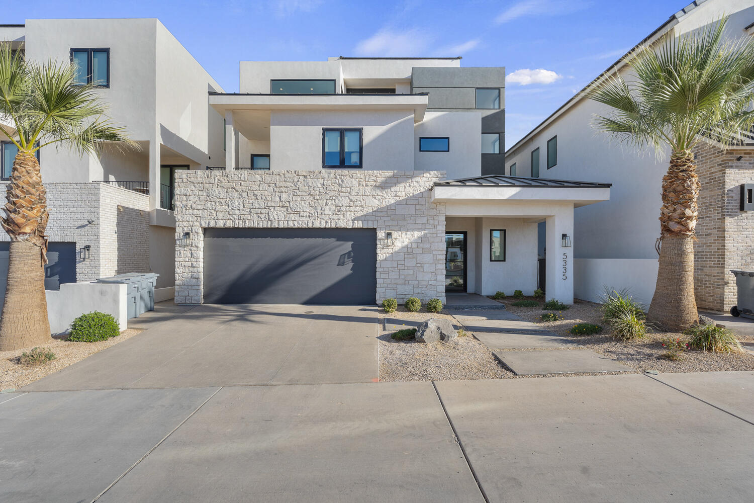 Elevated Luxury Living at this Desert Color Resort Oasis-Pura Sol! This stunning 3-story Split Rock home features 5 spacious bedrooms, effortlessly accommodating 18 guests in sheer comfort--no crowding! Enjoy your private patio with a pool, hot tub, outdoor bathroom and shower, barbeque, and ample seating for relaxation and entertainment. Expansive private decks and large picture windows throughout invite you to savor breathtaking views. A fully equipped fitness room, complete with a hydration station, caters to your wellness aspirations. Fully furnished and turn-key ready, this home is just steps from the lagoon, yet far enough to ensure peace and quiet. You will never want to leave this private sanctuary. Invest in this luxury retreat and profit. Don't miss your chance to own Pura Sol!