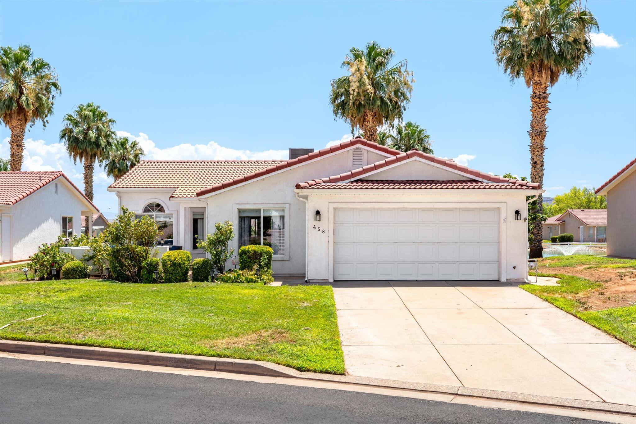 Prime location in desirable Padre Lakes Townhomes! This lakefront unit sits on the largest pond (Pond #2), offering breathtaking views from the covered back patio and master bedroom. Enjoy front-facing Red Mountain views right from the front porch and additional bedrooms.
Resort-style living awaits in this well-maintained community featuring a clubhouse, pool, fitness center, tennis courts, pickleball courts, and walking trails throughout--plus full yard maintenance included in the HOA. The unique floor plan offers abundant natural light, vaulted ceilings, and a welcoming grand entry that leads into a hallway with thoughtful angles and great energy, flowing into the great room.
Just minutes from Snow Canyon State Park for hiking, biking, and scenic adventures, with convenient access to Harmons, city walking trails, and all that St. George has to offer. Solid 2x4 construction, newer windows, and a newer AC system add to the appeal of this low-maintenance townhome.
